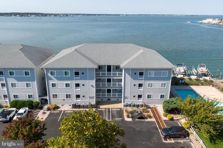THIS LOCATION HAS IT ALL! Nestled in the heart of Ocean City, Maryland, this spacious light and bright two-bedroom, two-bath condominium offers an unparalleled blend of gorgeous views, convenience, and coastal charm. Focusing on the  breathtaking western views, the condo is perfect for sunset lovers, showcasing serene vistas over tranquil waters that create a peaceful retreat. Make sure you bring your boat! A 10 year leased community slip conveys with the sale of this remarkable property, giving easy access to the Assawoman Bay, Atlantic Ocean and fantastic restaurants. ONLY two blocks to the Ocean City’s pristine beaches, where you can enjoy sun-soaked days and the gentle sounds of the surf. or watch the moon rise over the ocean. Whether you’re looking for a second home, a personal getaway, or a smart investment, this property fits the bill perfectly. Low condo fees and a low-maintenance lifestyle make it an ideal spot for easy, carefree living. Not only does this condo offer unbeatable views and proximity to the beach, but it’s also just minutes away from some of Ocean City’s best restaurants. Enjoy fresh seafood, local dining gems, and vibrant coastal nightlife all within easy reach. Perfect for personal use, a rental investment, or both, this condo offers everything you need for comfortable coastal living in one of Maryland’s most desirable locations.  Don’t miss your chance to own a slice of paradise!