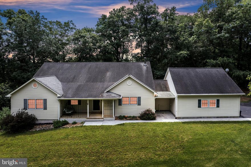 Expansive, energy-efficient retreat on 2.55 serene acres! Crafted in 1995 and meticulously maintained, this 5-bed, 3-bath residence offers nearly 4,000 finished sq ft with an easy main-level living option and abundant flex space upstairs and down. Inside, two-story and cathedral ceilings, rich laminate-plank floors, and over-sized windows brighten an open country kitchen, family room, and dining area, while pellet and wood stoves add cozy character and supplement the economical geothermal HVAC system.
Three bedrooms and two full baths are conveniently situated on the main level—including an expansive suite with a spa-style soaking tub—while the upper-level hosts two large bedrooms, a full bath, and generous walk-in closets. A roughed-in fourth full bath on the upper floor presents a great opportunity for future expansion. The walk-out lower level features a partially finished rec room, workshop area, and ample storage, inviting future media, hobby, or multigenerational spaces.
Outdoors, enjoy a rare blend of privacy and convenience: the landscaped parcel backs to mature woods at the end of a quiet cul-de-sac in Waterford Hills, just minutes from Westminster amenities. An asphalt drive leads to an attached 2-car garage, an attached carport, and a separate 24' × 24' detached garage—ideal for contractors, car enthusiasts, or extra storage. Covered porches, play area, and multiple outbuildings create room to garden, work, and unwind.
High-speed cable internet, 400-amp electric service, and well/septic sized for five bedrooms make everyday living effortless. With its spacious layout, quality construction, and peaceful setting, this home offers the perfect canvas for adding your own finishing touches. Schedule your private tour and experience the possibilities!