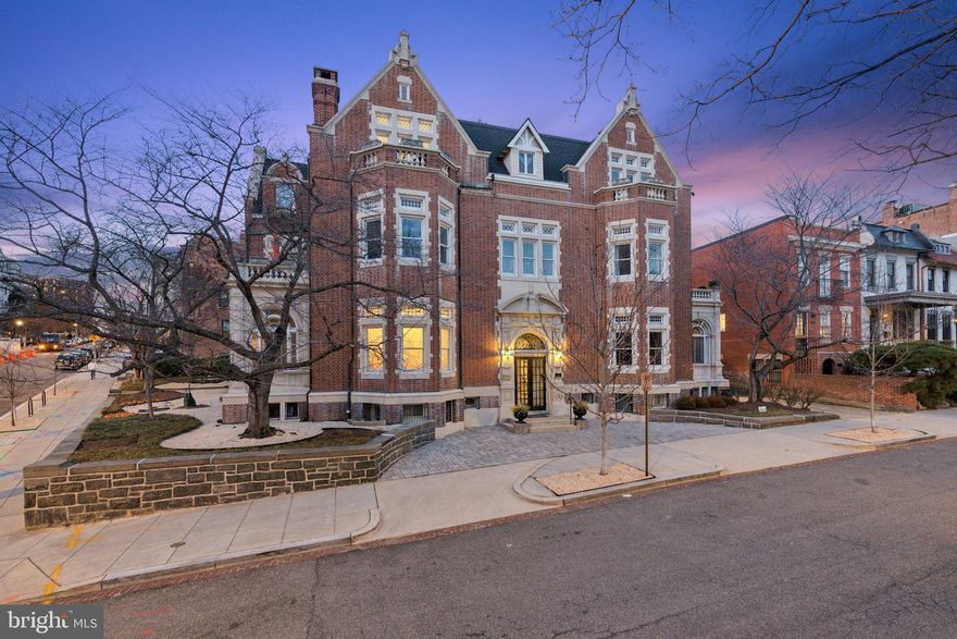 Step into a piece of Washington, D.C.’s history with this extraordinary residence in the prestigious Kalorama neighborhood. Originally built in 1902 as the Imperial Chinese Embassy and designed by renowned architect Waddy Wood, this one-of-a-kind home blends timeless elegance with modern convenience.

Spanning over 2,300 square feet across two levels, this residence boasts 11-foot beamed ceilings, intricate Jacobean paneling, and an original wood-burning fireplace with a cozy inglenook. The expansive great room, once the embassy’s formal reception hall and state dining room, now serves as a breathtaking living space with impressive scale, stunning crown moldings, and high-end flooring.

Designed for both refined entertaining and everyday comfort, the renovated kitchen is tucked behind the great room, offering privacy while remaining easily accessible to the living and dining areas. Thoughtful updates blend seamlessly with historic charm including a new Italian stone fireplace frame, two custom primary bedroom closets, and upgraded fixtures throughout.

One of this home’s most exceptional features is its two private outdoor spaces—a large deck and a sunken garden area—accessible from every room. Whether you are sipping coffee in the morning or hosting a soirée under the stars, the seamless indoor-outdoor connection is truly rare for a condominium.

Unlike any other unit in the building, this home includes a separately deeded driveway with off-street parking for two cars, as well as a private entrance directly from the street, providing unmatched convenience. Additional recent upgrades include: fresh paint throughout, a new HVAC (2022), a new water heater (2022), custom window treatments, and an updated primary bath with a new stone countertop vanity. 

Nestled in one of D.C.’s most prestigious and walkable neighborhoods, this home is minutes from Dupont Circle, Adams Morgan, and the U Street Corridor, with world-class dining, shopping, and cultural landmarks at your doorstep. A rare opportunity to own a piece of history—schedule your private tour today.
