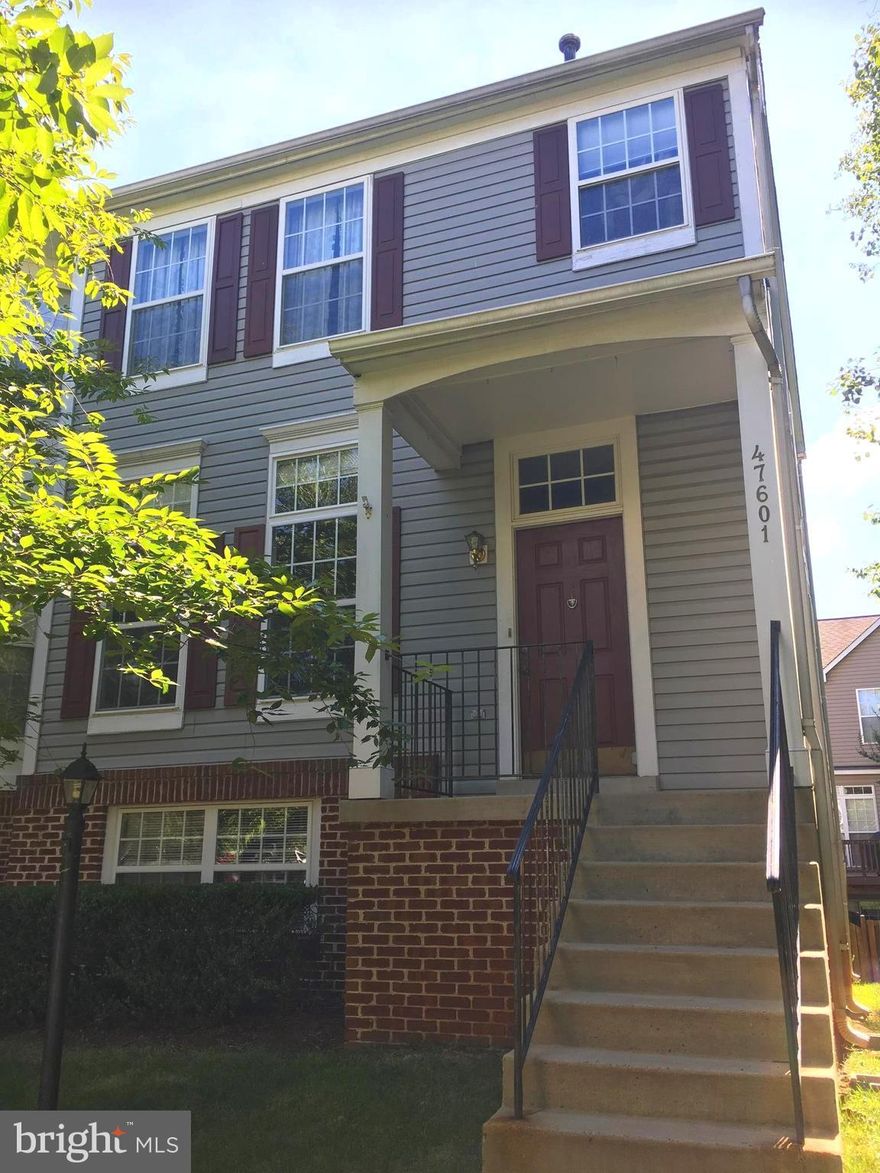 Spacious end unit town home in Lowes Island. 4 bedrooms & 3.5 baths. Wood floors on main lvl. Bright open gourmet kitchen w/island.  Newer carpet upstairs w/newer paint. Master suite has lux bath w/sep tub & shower. Lower level rec room w/walk out to big yard, 4th bedrm w/full bath.  Lots of guest parking. Walking distance to pool, school & restaurants. 15 mins from Tysons or Reston.  Must See.