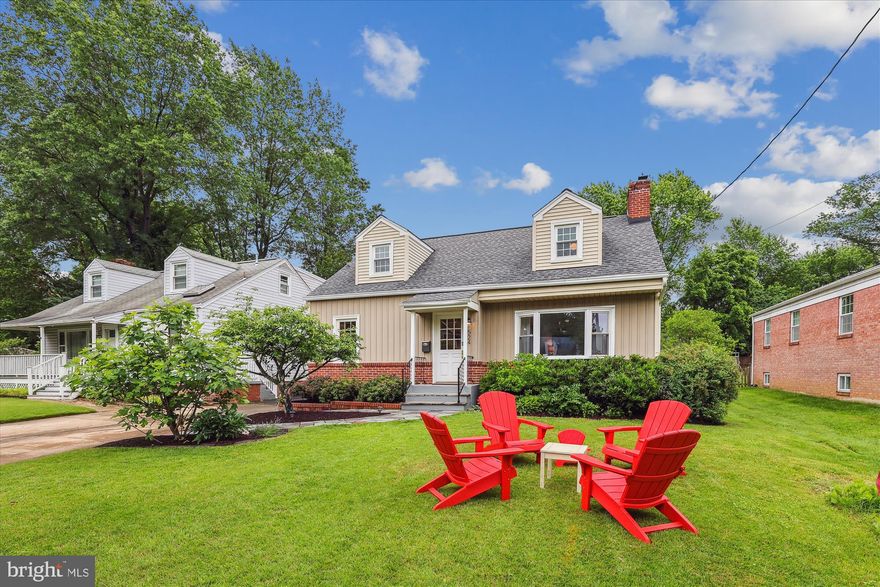 **OPEN HOUSE - Sunday 5/25 From 2 to 4 pm** 
 *FABULOUS* and *UPDATED* 4BR/2BA Cape Cod home, perfectly nestled in the vibrant heart of Falls Church City! Brimming with charm and modern touches, step inside to find sun-drenched living spaces, with beautiful hardwood floors, and an inviting open layout. The main level features a gourmet kitchen with custom cabinets and granite countertops, stainless-steel appliances and a peninsula with bar seating. Spacious dining room and inviting living room with a lovely corner brick fireplace with wood mantle.  Completing this level are three generously sized bedrooms; one that provides direct access to the spacious back porch area, plus an updated bathroom.  Upstairs, the expansive primary suite is a true retreat, complete with updated beautiful natural white oak hardwood flooring (2022), a dedicated home office space, walk-in closet, and a spa-inspired en suite bathroom featuring dual vanities and a stunning frameless glass shower with custom tile work. The finished lower level provides a versatile family room with built-in shelving and a laundry area—perfect for movie nights, playtime, or a home gym. Step outside to a private backyard oasis with a large, covered porch—ideal for outdoor dining, entertaining, or simply unwinding. The generous yard offers endless possibilities for gardening and recreation. Close to everything you need in Falls Church City - Lincoln Park, W&OD Trail, FCC Farmers Market, Founders Row restaurants and shopping! Close to commuters routes to DC, Tyson’s Corner, and Metro.   Falls Church City Schools!
