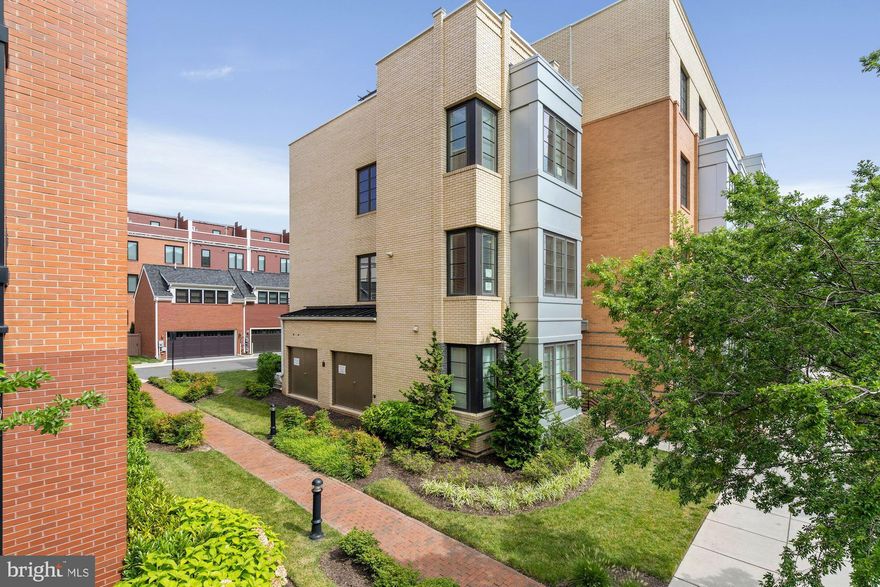 Seller will consider offers prior to going live on 5/29/25!!  This stunning three-level, end-unit townhome is worth the wait—offering an exceptional blend of elegance, functionality, and prime location.
Step inside and discover three spacious bedrooms, each with its own full bathroom, ensuring comfort and privacy for all. The Murphy bed and custom-built office setup in the main-level bedroom create a versatile space, perfect for remote work or welcoming guests.
The heart of the home shines with its open-concept design, flooded with natural light from additional windows—a special perk of being an end unit! The brick accent wall in the living and dining areas adds a touch of sophistication, making every moment spent here feel special.
Enjoy the luxury of custom built-ins throughout—from chic bookshelves in the living room to custom closet systems in the primary suite. The laundry room, conveniently located between the primary and guest bedrooms on the third floor, offers extra cabinetry for effortless organization. And yes, hardwood floors in the primary bedroom add even more charm!
But what truly sets this home apart? An integrated built-in surround sound system on every level—perfect for immersive entertainment, whether you're hosting guests or enjoying a quiet night in. And when it’s time to take the experience outdoors, the deck off the kitchen makes grilling a breeze, while the spectacular rooftop terrace—spanning the length and width of the townhome—creates the perfect retreat. Whether you're unwinding with a book, soaking in the panoramic views, or enjoying breathtaking fireworks displays, this space is an absolute showstopper!
Luxury, Location, Lifestyle. Yes, You Can Have It All! Less than 1 mile from  Amazon HQ2 headquarters & Crystal City,  walkable to Potomac Yard Metro  yet Metro direct shuttle line is just steps from your front door, walk across the street to dine at the New Founding Farmers restaurant, with more on the way, or continue just 4 more blocks and enjoy the shops/dining scene in Del Ray!  Virginia Tech Innovation Campus, Old Town and Regan Airport are less than a 10 mins away, no to mention amazing Bike/jogging trails along Potomac Ave that lead to scenic GW Pkwy! WELCOME HOME!