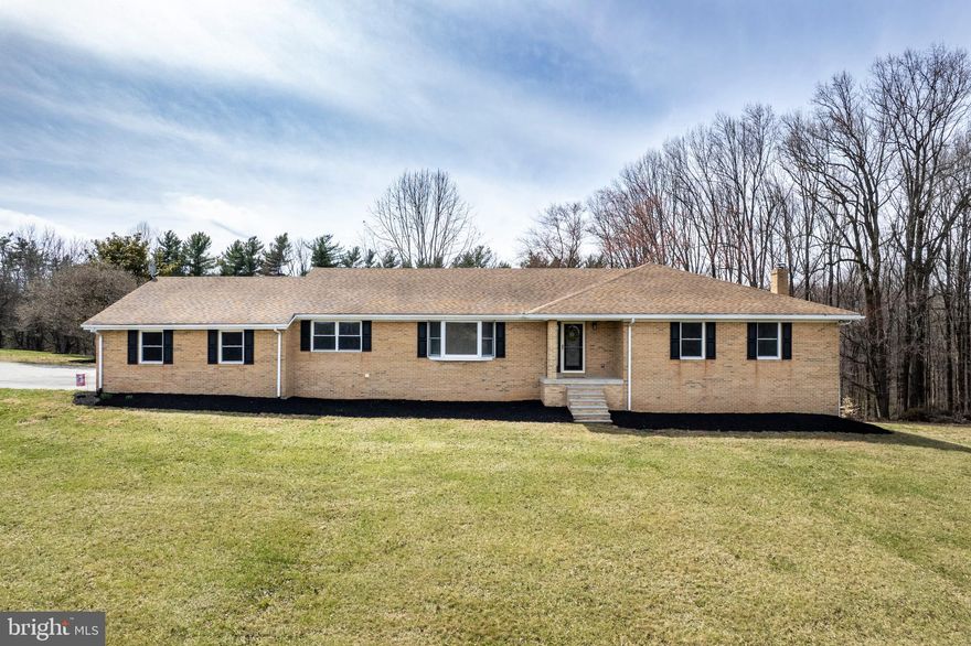 Price improvement at Silver Run Valley.  This lovely, updated all brick rancher on just over 9 acres awaits a new owner.  This home is grand, not only in the space offered but also in the thoughtful design, top to bottom.  The main level of this impressive ranch home offers 5 bedrooms with 2.5 baths, laundry/mud room, formal living room, separate dining room, family room w/ fireplace insert and a new kitchen w/ LVP flooring throughout.  The kitchen sparkles with quartz counters, white soft close cabinets and stainless appliances. The lower level is just as impressive with LVP flooring, a full bath and rooms galore that can be designated for many uses.  This space would make an amazing in-law or teen area with bedroom option, den, living, dining, kitchenette, laundry and still has tons of storage options.  The lower level has a walk out to covered/enclosed patio, 2 egress windows and a woodstove on brick hearth.  Peace and tranquility will surround you on the grounds with a mix of pasture, woods, and functional yard space.  The wildlife will be your closest neighbors.  Bring a few horses or steers, plan your 4-H projects with the 30x20 barn for cover. Plant gardens and watch the birds.  If you need a workshop with electric or have equipment to store, you will find the pole building fascinating! Three large doors and concrete floor in this 64x46x14 pole building.  But if at the end of the day, you would just rather hit the pause button and sit back to relax, you can do that as well.  Choose from the back deck, covered patio or take in the truly amazing valley views from the front porch that awaits you at 1321 Silver Run Valley Road.  Open House Saturday 4/19 from noon -2p