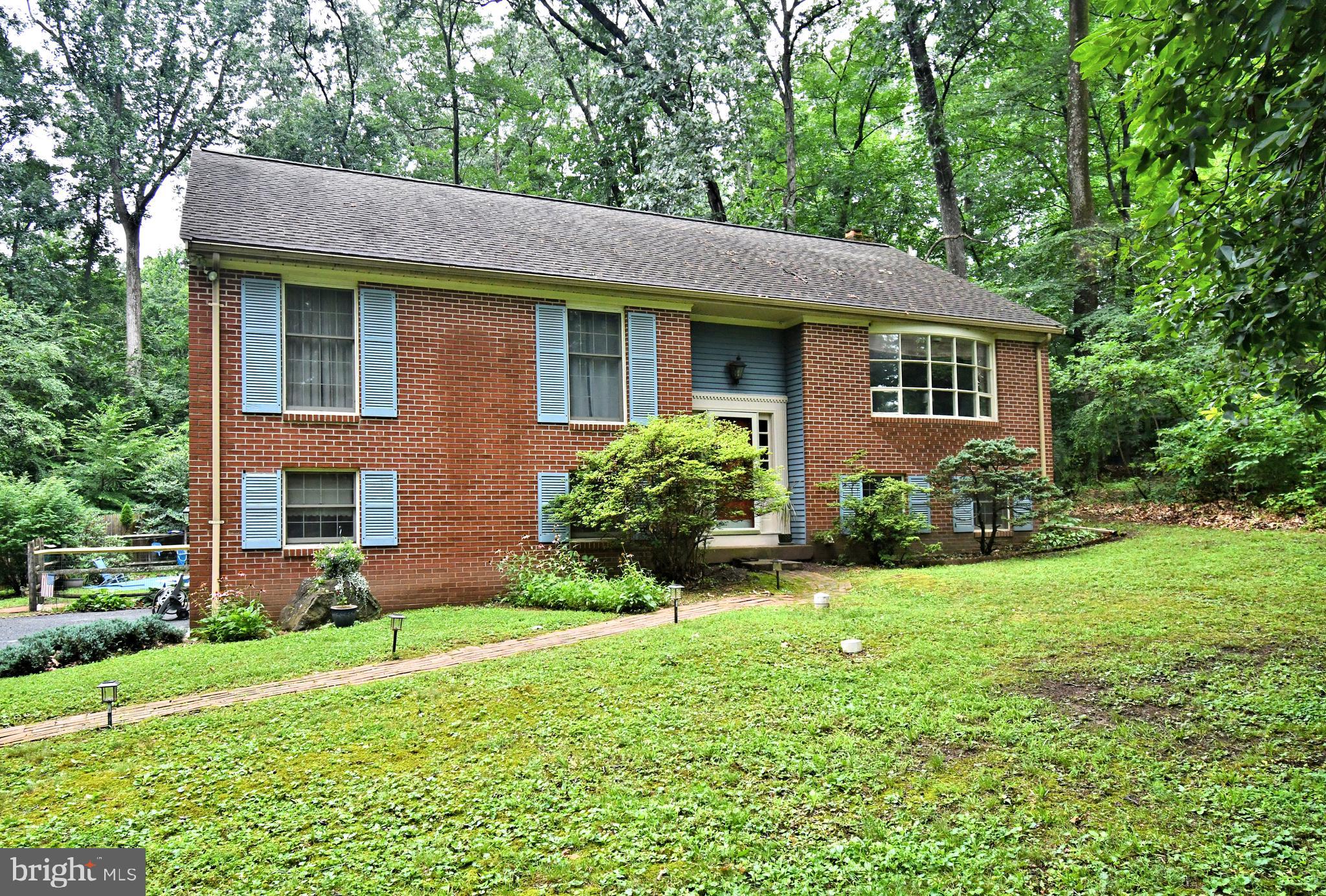 Looking for peace and privacy? This charming home, nestled at the end of a quiet cul-de-sac on a full acre of land, offers the perfect retreat. The main level features a bright living and dining room combo with a sliding glass door that leads to a spacious deck, which steps down to a private patio and in-ground pool—ideal for summer entertaining. The eat-in kitchen is filled with natural light from a skylight and features appliances that have been updated within the last 7–10 years. Down the hall are three generously sized bedrooms, each with ceiling fans. The primary bedroom includes both a walk-in closet and a double closet, a private vanity area, and a second skylight, along with convenient access to the full hall bath. Additional storage can be found in the pull-down attic, which is partially floored.
The lower level boasts newer flooring throughout, a cozy family room with a fireplace, an updated full bathroom, a laundry area, and a walk-out slider that provides easy access to the backyard pool area. The spacious two-car garage on this level offers heating capability, making it a great space for workshops or additional projects. Major updates include a 2-year-old HVAC system, a PVC septic line replacement in 2020, a pool filter replaced 3–4 years ago, and pool equipment updated approximately 5 years ago.
This home has been thoughtfully priced to reflect the need for interior cosmetic updates—offering a great opportunity to personalize and add value. With solid bones, abundant space, and a peaceful setting, this property is ready for its next chapter.