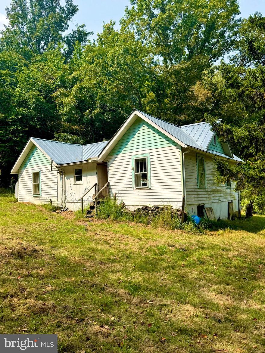 In Seneca Rocks, a rare opportunity awaits, offering 35+ acres of land for purchase, featuring a charming 1930-built home perfect for hunting enthusiasts. With 1377 square feet, 2 bedrooms, and a full bath, this property also boasts electric, well water, wifi, and a shared spring, surrounded by mature timber with nature's edible treats for local wildlife. A scenic water crossing provides access, making this a secluded mountain retreat.