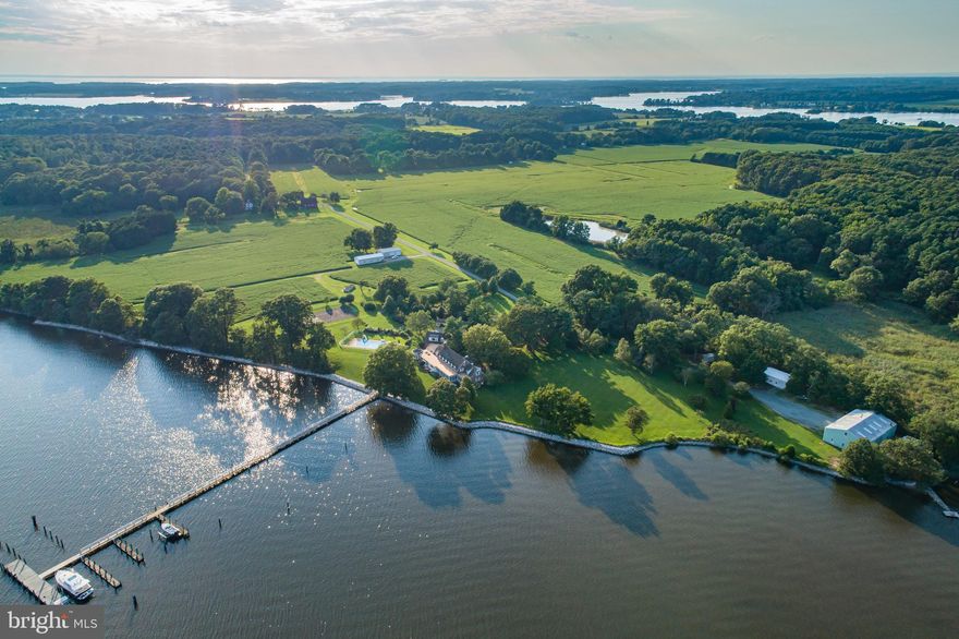 Bachelors Hope Farm,  a once-in-a-lifetime deepwater hunting farm, with tillable acreage, is being offered for sale for the first time in 50 years.  A private sanctuary with two houses, an insulated boathouse with a railway launch, over 3,000 feet of frontage on the Chester River and over 1,400 feet of stone revetment, this waterfront retreat cannot be replicated.  The property offers nautical features that are unmatched - true deepwater, with 8' MLW at the 420 foot dock, with water & electric, and at least six slips. The large, insulated, and heated boathouse has a 150 foot private railway launch.  The lift system inside the boathouse allows for indoor storage of multiple boats, as well as storage room for smaller boats plus a complete marine workshop.  Of the total 164.13 acres, 96 are tillable, 43 are wooded, and the farmland boasts three ponds.  The original farm barn and silo stand proudly near the entrance of the property.  The main home offers sweeping views of the Chester River from every room, with seven bedrooms, including three master suites, and a handicap accessible in-law suite.  The four bedroom, two and a half bathroom Farm Home was built in the early 1900s and renovated in 1994.  The conservation easement allows for the construction of a third residence to accommodate a caretaker or complete the construction of a family compound.  Bachelor's Hope Farm is the perfect site for a family compound to escape from the city, hunt, farm, play tennis, relax by the pool, and enjoy private dockage for your boats of any size.  Less than two hours to Philadelphia, Washington, DC, and Baltimore, three hours to New York City, and a short boat trip to Annapolis and Baltimore.  Schedule your private showing.  No drive bys please, listing agent must accompany all showings.