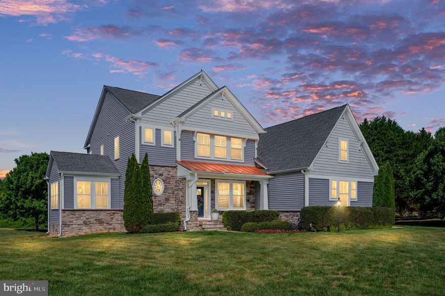 Welcome to this beautifully maintained craftsman-style farmhouse located in the extraordinary Bloomsbury Farm Estates community. Built in 2015 by Atlantic Builders and situated on a private 2.06-acre cul-de-sac homesite, this exceptional residence offers modern comfort, timeless charm, and peaceful country living—all while being just minutes from everything the Spotsylvania and Fredericksburg area has to offer. Best of all, this pristine neighborhood has no HOA, giving homeowners added freedom and flexibility.
Thoughtfully positioned to capture natural sunlight throughout the day and breathtaking sunset views each evening, the home feels warm and welcoming from the moment you arrive. Professionally landscaped grounds, an extended driveway, and an oversized three-car side-load garage create beautiful curb appeal and a lasting first impression. Inside, this light-filled home features an open and thoughtfully designed floor plan with 9-foot ceilings on all three levels, upgraded hardwood flooring, upgraded carpet, and oil-rubbed bronze hardware throughout. Designed for both everyday living and entertaining, the main level offers a grand foyer, formal dining room with a tray ceiling and chair rail, private office or craft room, morning room, sunroom, and an expansive great room anchored by a stunning gas fireplace with a stone surround, raised hearth, and wooden mantel. At the heart of the home is the gourmet kitchen, featuring upgraded GE Café Series stainless steel appliances, a five-burner gas cooktop, pot filler, upgraded granite countertops, a stainless steel single-bowl under-mounted sink, and a large center island ideal for gathering and casual dining. The kitchen flows seamlessly into the casual dining area and family room, creating the perfect layout for entertaining. Just off the kitchen, a pocket office provides an ideal work-from-home or organizational space. The mudroom entry from the garage includes a granite-topped cabinet, a large coat closet, and room for additional built-ins, while the adjacent laundry room offers cabinetry, ceramic tile flooring, granite countertops, and a stainless steel utility sink. Upstairs, the luxurious primary suite serves as a private retreat with scenic views, a tray ceiling, two spacious walk-in closets, and a spa-inspired bath featuring quartz countertops, a freestanding soaking tub, and an oversized tiled walk-in shower. One secondary bedroom enjoys access to a nearby full bath, while two additional bedrooms share a Jack-and-Jill bathroom. A spacious bonus room offers incredible flexibility as a 5th bedroom (NTC), playroom, guest suite, or media room. The basement, completed in 2024 by HIVEX Basement Finishing Company, adds exceptional additional living space with a full bathroom, expansive recreation room, a wet bar with a sink, refrigerator, and microwave, plus a gym and private office that could alternatively serve as additional bedrooms (NTC).
Outdoor living is equally impressive, with a large rear patio featuring a newly installed hot tub and the perfect setting to enjoy peaceful evenings and spectacular sunsets. The private acreage and quiet cul-de-sac location provide the ideal backdrop for bike rides, neighborhood walks, and enjoying the outdoors.  Conveniently located, the home is less than 4 miles from the shops and restaurants at Spotsylvania Courthouse,  under 6 miles from Cosner's Corner shopping center, just 8.5 miles from the Rt. 3/Central Park area, and under 10 miles from downtown Fredericksburg. For commuters, the home is  just 14 miles from the Spotsylvania VRE Station, 19 miles from the Fredericksburg VRE Station, 34 miles from Quantico, and 36 miles from Dahlgren. Meticulously maintained and truly move-in ready, this exceptional property offers a rare opportunity to enjoy premium upgrades, modern construction, acreage, and a thoughtfully designed layout in one of Spotsylvania’s most desirable and perfectly placed communities.