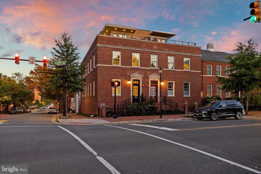 Enjoy the Best of Old Town!  Steps to the finest restaurants in the city and an 8 minute uber to National Airport. Welcome to this rare semi-detached, sun-filled property, which is one of the largest townhomes in historic Alexandria with elevator access to all four levels. Almost 3500  finished sq ft with an 800 sq ft roof top terrace. 
 Perfectly located just steps to grocery stores, restaurants (18 restaurants within 3 blocks), boutiques and fitness classes.  This property offers three bedrooms with 3 ensuite baths and walk in closets , 3 half baths,  office, den, family size dining room, family room, living room, and rec room and an exceptional  800 sq ft outdoor roof terrace with showstopper views of Old Town and the Potomac River.  The open gourmet kitchen features Italian Snaidero cabinetry, Thermador appliances, wine cooler and quartz countertops, with island bar seating on both sides.  The welcoming main level is a place for family and friends to gather with room for grand size dining table and an impressive living room with room for a grand piano. 
The family room in back will accommodate a sizable  TV for the football fans.  All baths feature Waterworks fixtures and Toto Toilets. The primary bath has marble floors, large soaking tub,  separate spa shower and dual vanities.

 Owners have spared no expense in improving this move-in ready property, adding custom garage flooring and storage and EV charger, New HVAC, 2 tankless HWH's,  top-to-bottom stair runners, and custom window treatments throughout.  Enjoy modern Old Town living at its finest.