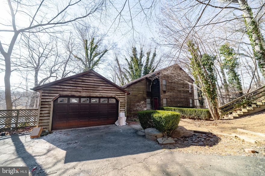 Welcome to this stunning mid-century modern waterfront home in the sought-after Occoquan
Forest community of Prince William County. Set on a serene 0.56-acre wooded lot along the
Occoquan River, this Waterfront residence offers rare architectural character, tranquil water
views, and a private dock-creating a true retreat while remaining close to everyday
conveniences. The home features spacious rooms, beautiful hardwood floors throughout the
main level, rich wood trim, and custom details that reflect timeless mid-century design. It has
two brand new HVAC systems and a recent roof replacement of architectural shingles with a
warranty that conveys. It also has its own private dock, a wraparound deck on the main level
of the house and an extra large party deck by the water, adding to the unique lifestyle this
property offers. Sauna and pool table convey with house. HOA is voluntary in Occoquan Forest
community. Optional membership provides access to private river amenities including a boat
ramp, dock, canoe racks, playground, dog park, picnic pavilion, and scenic walking trails.
Occoquan Forest is known for its winding roads, mature trees, and peaceful setting, all just
minutes from shopping, dining, major commuter routes, and the charming towns of Clifton,
historic Occoquan, and Old Town Manassas. With easy access to Route 123, Route 28, and the
Prince William Parkway, this home delivers the perfect blend of waterfront living, architectural
charm, and commuter-friendly convenience. If you've been searching for a distinctive home
that offers privacy, natural beauty, and a vibrant community, this waterfront gem is not to be
missed. Antique truck in garage and pontoon boat by the dock do not convey. House will be
sold “AS IS.”