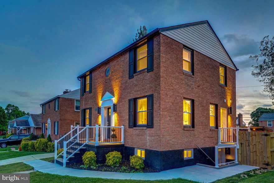 It is quite possibly one of the most beautifully renovated homes in all of Baltimore County—a refined statement of understated classical elegance. This timeless brick colonial is perfectly sited on a square, fully fenced lot in the heart of a desirable residential block, offering exceptional curb appeal and thoughtful design at every turn.
Completely reimagined from the inside out, everything beyond the original brick exterior walls is brand new. The home has been fully gutted to the slab and rebuilt with a meticulously redesigned floor plan that delivers ideal room proportions, seamless flow, and modern functionality. Major system upgrades include all-new plumbing, electrical, and mechanical systems, a new sump pump drainage system, and premium insulation throughout all three levels—including closed-cell foam insulation across the entire roofline for superior energy efficiency.
Upon entry, you are welcomed by a dramatic 28-foot soaring foyer filled with natural light, anchored by a stunning Morison pendant and a custom-designed staircase. The open-concept main level is both elegant and inviting, showcasing designer finishes and high-end materials throughout. The gourmet kitchen features a large island with seating, abundant cabinetry, a full Silestone backsplash, and GE Café series appliances. The adjacent living room is highlighted by a wood-burning fireplace wrapped in striking 3D tile, while the spacious dining area comfortably accommodates a table for eight and is elevated by a sophisticated Kate Spade chandelier. A magazine-worthy powder room completes the main level.
Upstairs, each bedroom impresses with rare 12-foot ceilings, generous proportions, and custom-organized closets. The expansive owner’s suite offers a luxurious, spa-inspired bath with a double floating vanity, makeup station, and a large, thoughtfully designed walk-in closet.
The fully finished walkout lower level expands the living space with a large recreation room, a bedroom suite with full bath and organized closet, a dedicated laundry room with sink, and additional storage space—ideal for guests or multi-generational living.
Designed with both comfort and entertaining in mind, the home features 87 LED recessed lights on dimmers throughout, complemented by a curated decorative lighting package by Visual Comfort & Company. Premium flooring spans the entire home, reinforcing the sense of quality and cohesion.
The exterior is equally impressive, offering a newly installed concrete patio with a covered grill gazebo, a custom-built storage shed, and a level, square backyard that is fully fenced and gated—perfect for outdoor gatherings or quiet relaxation.
This is a rare opportunity to own a truly turnkey home where every detail has been thoughtfully executed and every box is checked. A standout offering in its price range—this is the home you’ve been waiting for.