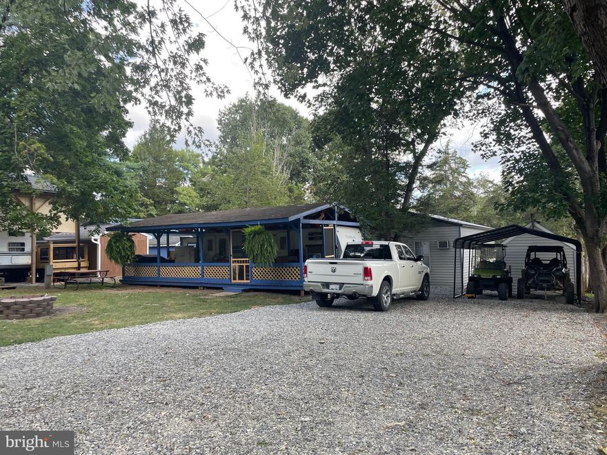 Seller wants lots sold!  Don't miss out on this one!  DOUBLE LOT WITH ONLY 1 DUE, 2nd lot is a deferred lot.   So, if you are the folks with all the toys or need extra parking, this could be the perfect lots for you.  The deferred lot has just been surfaced with crush and run and new carport added.  The other lot offers cover pavilion which has a new roof with architectural shingles, freshly stain pavilion and screen in deck area.  The camper offers, fresh paint, new refrigerator and private bedroom, and another queen bed at other end of camper, a full bath and area for a pull-out couch.   You will be able to enjoy large front yard with a huge new firepit.   Don't delay, not often do lots come with 2 lots and 1 set of dues! 
OWN YOUR SPOT OF THIS IS A SEASONAL CAMPGROUND! OPEN FROM APRIL 1 TO NOVEMBER River Bend is a privately owned 400 acres recreational- vehicle camp resort with seasonal activities for members, families and guests. This great RV park is tucked away on the Upper Potomac River of West Virginia; River Bend is one of West Virginia's most popular family seasonal destinations. Just a short drive from the Washington and Baltimore metro area. Open with utilities, included in the dues from April 1 to November 1. Lot owners have access to their property the entire year. Come and enjoy amazing views and wildlife with Potomac River access, the boat ramp gives you access to the Potomac River with approximately 10 miles of Deep Water, so bring your boat and jet skis too! Side by side riding trails, 3 swimming pools, mini-golf, youth center, tennis and basketball courts, laundry facilities, convenience store, with deli and, bar and grill and even a church located on the grounds, bath houses. River Bend also hosts numerous activities such as 4th of July fireworks, small carnival, bonfires, poker runs, horseshoes tournaments, car show, Halloween Trick or Treat and live bands and so much more! Come check it out and enjoy some River Bend Fun!