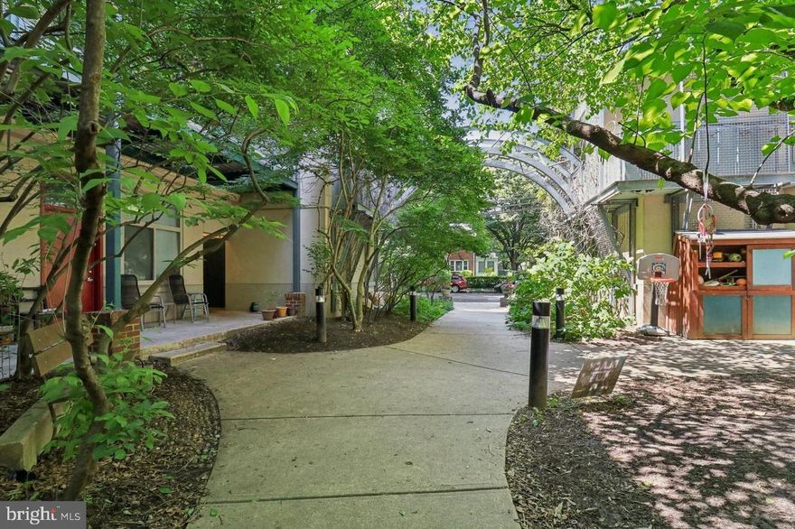 Looking for more than just a home—seeking a true sense of community? Welcome to the highly sought-after Eastern Village Cohousing Community. This vibrant, neighborly village offers far more than a place to live; it provides a warm, connected lifestyle in the heart of Silver Spring.
Discover your serene oasis in this rare and stunning one-level condo featuring 2 bedrooms, 1 bathroom, and over 833 sq. ft. of private living space. The home boasts beautiful bamboo floors and a modern kitchen equipped with granite countertops, gas cooking, and a spacious breakfast bar—perfect for any home chef.
Enjoy the outdoors in the inviting community courtyard, ideal for relaxing or entertaining. Parking is easy with on-street options and rentable public parking just steps away. The building is pet-friendly, all-age-friendly, and fully accessible.
Extensive community amenities elevate daily living. Eastern Village features a garden courtyard with a grill and fire pit, dedicated event spaces, and a rooftop garden with breathtaking park views. Indoors, you’ll find a workout room, workshop, computer room, kids’ room, game room, three guest suites, meditation room, free extra laundry rooms, library rooms, indoor bicycle storage, and multiple meeting and gathering spaces. Eco-conscious residents will appreciate the building’s solar power and geothermal heating and cooling.
Whether you’re an introvert seeking quiet green spaces or an extrovert who loves local events, this location truly offers something for everyone. Outdoor enthusiasts will love the proximity to Rock Creek Park’s hiking trails, wildlife, stables, waterside paths, and picnic areas. Meanwhile, downtown Silver Spring offers parks, community gardens, libraries, groceries, metro access, an aquatic center, fitness studios, theaters, cafés, shops, and a full calendar of live events.
Experience the perfect blend of tranquility and vibrant community living at Eastern Village. Don’t miss the chance to make this exceptional condo your home. Discover the joy of living in a place where every day feels like a retreat—schedule your showing today and step into a lifestyle that truly stands apart.