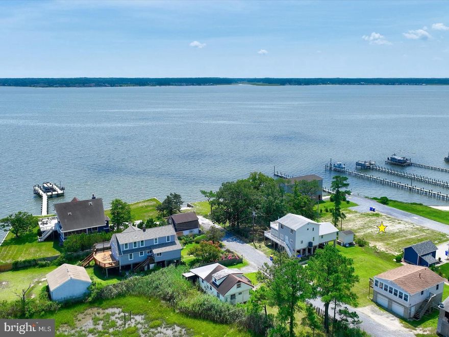 Beautiful cleared lot with unobstructed views of the Indian River Bay. Existing water & sewer on site. Located on a peninsula of land that offers amazing views of the bays, marshes, & wetlands in every direction. Quiet, friendly section of Oak Orchard, with great food, entertainment, & shopping nearby, without all of the hassle of the resort beach traffic!