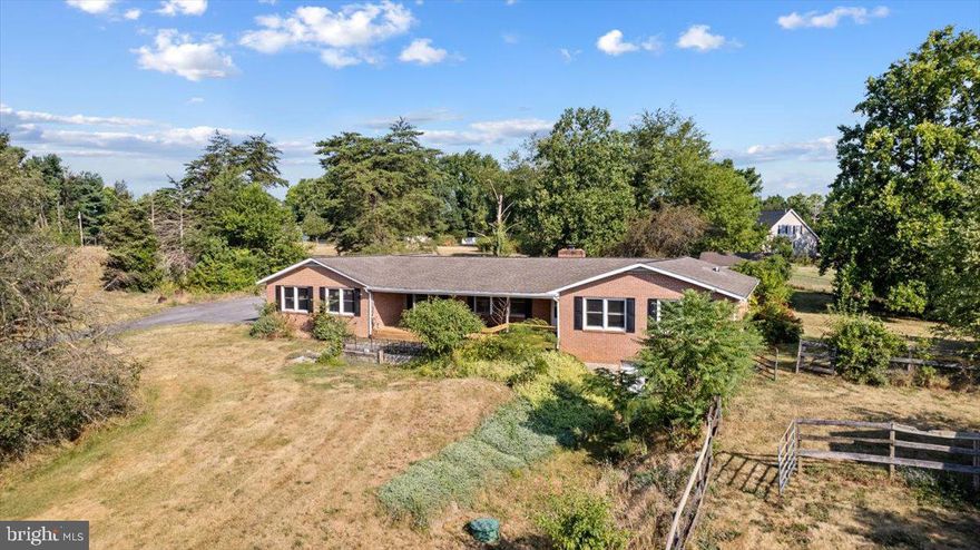 Are you looking for land just minutes from the Virginia and Maryland state lines, this is it! This property has 2.5 fenced acres, with a run-in shed perfect for horses.  The brick ranch style home has 3 nice size bedrooms, 2 of the rooms have been turned into a private suite, with a sitting room, a separate private full bath and kitchenette.  The owners suite has an updated private bath. The main kitchen is open to the family room which features a floor to ceiling brick fireplace. The living room and front porch feature a beautiful view of the mountains.  The bonus room can be used as a formal dining room or ideal for office space.  There is a “rough in” for a third bath on the lower level. The 2-stall garage is spacious and oversized with a separate entrance that has a main level mudroom and laundry.  There is an additional storage shed on the property. All the amenities,  restaurants, shopping, gym, post office and more are just around the corner making this a great location!

** Accepting Back up Offers**