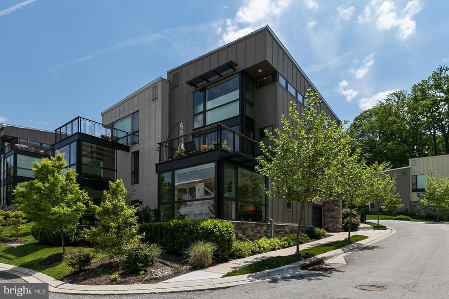 ORIGINAL BUILDER MODEL - LEED SILVER CONTEMPORARY DUPLEX in Clipper Mill! No other homes like this in Baltimore! Italian Valcucine cabinetry,  stainless Bosch appliances. UPGRADES THROUGHOUT! Custom Guitierrez stairs & fireplace. Two master BRs on upper level. Wood floors on main & upper levels. Ground level family room/office (or BR 3). Whole-house audio. Central vac. Solar shades. 2-car garage.