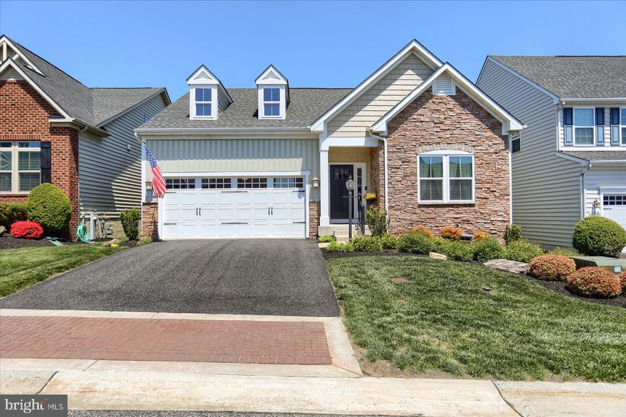 Welcome to resort-style living in the exclusive gated community of Bulle Rock in historic Havre de Grace. This beautifully maintained single-family home offers the ease of one-level living with 3 bedrooms, 3 full baths, a 2-car garage, and thoughtful upgrades throughout. A partial stone exterior, inviting curb appeal, and professionally landscaped surroundings set the tone for the exceptional lifestyle that awaits.

Step inside to discover a bright, open-concept layout that seamlessly connects the spacious living room, kitchen, and dining area into one inviting gathering space. The beautifully appointed kitchen features granite countertops, an extended island with seating, custom cabinetry with convenient lower slide-out drawers, under-cabinet lighting, and abundant prep and storage space. The new stainless steel refrigerator and gas range installed in 2024 add modern style and functionality. Hardwood flooring flows throughout the kitchen and dining area, where large windows and easy access to the outdoor space create the perfect setting for everything from quiet morning coffee to hosting family and friends. Tucked away on its own side of the home, the luxurious primary suite features a spacious walk-in closet and versatile alcove perfect for a home office, reading nook, or cozy lounge area. The elegant ensuite bath serves as a relaxing retreat with a dual sink vanity, soaking tub, and walk-in shower. On the opposite side of the main level, you’ll find two nicely-sized secondary bedrooms with generous closet space and a full bath conveniently situated between them. The main-level laundry room, located just off the garage entry, adds everyday convenience and practicality to the layout.

The current owners further enhanced the home in 2025 by partially finishing the lower level to include a stunning full bathroom with upscale modern finishes and a walk-in shower, and a large recreation room perfect for guests, hobbies, movie nights, or flexible living space. With convenient walk-up access to the backyard retreat, the lower level seamlessly extends the home’s indoor and outdoor living experience. The unfinished portion offers abundant storage and potential for future expansion.

Outside, enjoy a low-maintenance hardscape patio surrounded by mature trees and beautiful gardens, creating a peaceful setting for relaxing or entertaining. Lawn care, snow removal, and trash service are all included, allowing you to fully embrace the carefree Bulle Rock lifestyle.

Residents enjoy access to exceptional amenities including indoor and outdoor pools, a state-of-the-art fitness center, tennis and pickleball courts, bocce ball, playgrounds, walking trails, a billiard room, library, a variety of clubs and activities, and optional discounted golf memberships. Just minutes away, downtown Havre de Grace offers waterfront dining, shopping, arts, entertainment, marinas, and scenic views along the Promenade and Tydings Park. This is more than a home, it’s a lifestyle!