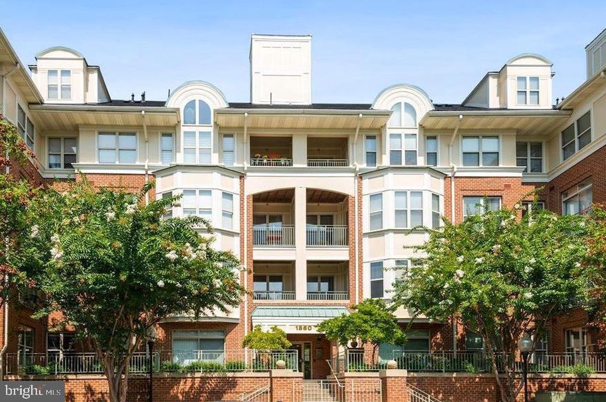 BACK ON THE MARKET!!!   THEIR LOSS IS YOUR GAIN!!   Gorgeous sun drenched 2 bedroom 2 bathroom condo across the street from the Reston Town Center. And oh the views!!!  Looking over the W&OD as well as to RTC this unit receives Southern exposure so lots and lots of sunlight!!  And does not look directly into another building -- privacy abounds!! With over $90K in recent (less than 2 years) updates/upgrades this unit will not disappoint. Every surface in this unit is newer, from the ceiling with new insulating soundproofing to the beautiful walnut stained engineered hardwoods you will not want to miss out on this opportunity to make it your home. Gourmet kitchen with 42-inch cabinets, quartz counter tops, under mount stainless farmhouse sink and gas stove/range. Bulkhead was removed around kitchen area modernizing the space. En suite primary bath gutted to the studs to raise ceiling and create spa-like space adding soaker tub w/ it's own shower and glass surround stand up shower, double vanity and linen shelving. Sun room doubles as home office. Built in bookshelves with gas log fireplace is cozy and warm on cold winter days. Enjoy summer days at the community pool or workout at the Fitness Center.  HVAC April 2021, water heater Sept 2023 , appliances Spring 2023, washer/dryer July 2024, gas fireplace just cleaned and serviced within the month.  
1 assigned garage parking space, and plenty of unassigned outdoor parking as well as additional storage unit. Convenient to all transportation and commuter routes -- two metro stops (Wiehle and Reston), Dulles Toll Road. Stroll across the street to restaurants, shops and entertainment. Luxurious condo living at it's best in Reston.  Open house Sunday, 2/9  12:00PM-3:00PM.