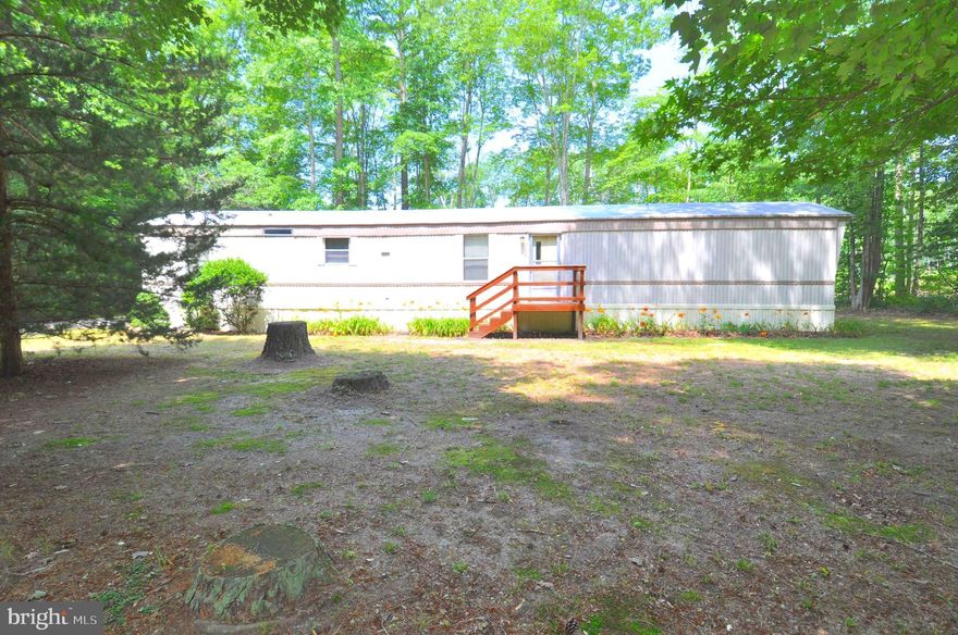 3 Bedrooms, 2 Full Bathrooms, LR, Kitchen and Dining Combo with plenty of cabinet space. Utility area. Has approximately   2.27  wooded acres. The home has 924 sq ft of living space. It is in Good condition and Clean. There are two sheds (one metal and one wood ).  Includes Refrigerator,  Electric Range, Electric
Water Heater plus washer & dryer. Ceiling Fans are in Living Room and Bedrooms. The window A/C unit is included.  Has deep well and  Private Septic system. Has screened porch entrance (in back). Dish TV satellite available. Property is in good condition with no known major problems. Selling in "As Is" condition Close to
several boat ramps and minutes away from many parks the Chesapeake Bay and National Seashore at Assateague Island, Va.