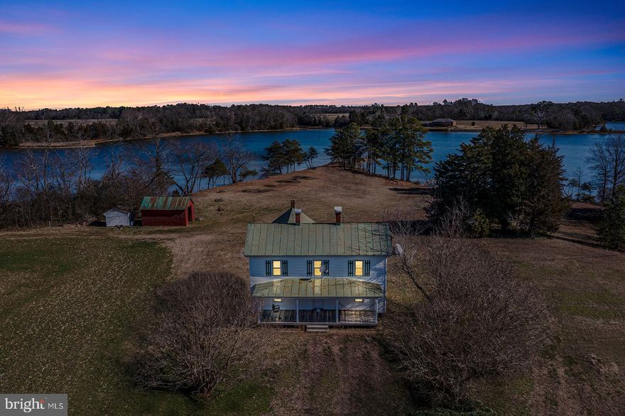 GREAT NEW PRICE! Rare Offering of on a Magnificent 9.5 acre Waterfront Point!! Lovely fields lead to mature trees along the waters edge with a very Impressive 1,700 feet of Shoreline! This is an ideal parcel for buyers seeking ultimate seclusion as it is Surrounded by over 100 acres of pristine Land. Several Locations for a Potential new Homesite would all offer Panoramic Water Views ! Or Revive The Circa 1900 Built Classic Farmhouse which has lots of potential with Highlights of: wood floors, Fireplaces, Gorgeous Wood moldings and Trim throughout, a 32x 8 Front Porch, appealing Original doors, Built in China Cabinet, and lots of old Charm that is Sure to Please! Several Outbuildings for storage too. Take a Peaceful Stoll to the Pier or your own Small beach! This is an Enchanting Property for sale that promises to inspire every person the minute they lay their eyes on it.PLEASE -- DO NOT DRIVE BY ! MUST HAVE SET APPOINTMENT APPROVED WITH LISTING AGENT.