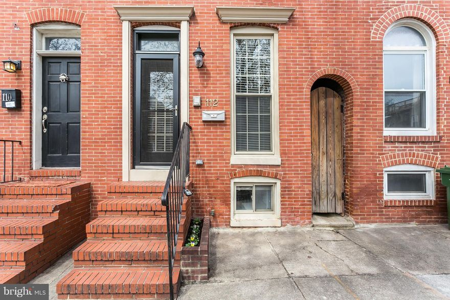 Spacious & Bright Federal Hill Townhouse w/ Detached Garage! The large living room features hardwood floors, exposed brick and a wood burning fireplace. The kitchen has been updated w/ granite & stainless steel appliances. Upstairs find 2 bedrooms, 2 full baths, the laundry, & central access to the maintenance-free trex rooftop deck. The lower level is partially finished for a den/playroom.