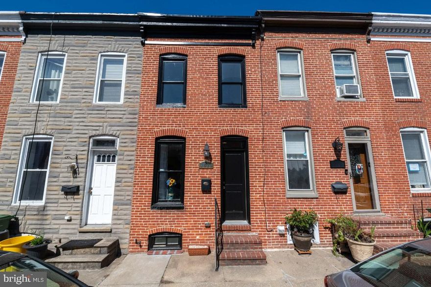 Lots to love in this updated  Federal Hill rowhome with one year of CHAP tax credit left! This surprisingly spacious 2-3 bedroom / 3 bathroom home sits on a quiet, one-way street and offers so many upgrades including stainless steel appliances, hardwoods throughout, recessed lighting, exposed brick walls, and en-suite primary bathroom. A large fully finished basement with a third  full bathroom makes the space an optional 3rd bedroom or bonus family room. There is no lack of outdoor space either with a private patio off the kitchen and large rooftop deck with beautiful city views.  Freshly painted and with new carpeting, this home is totally turn-key.  Convenient location to I-95, Riverside Park, the Cross Street Market, McHenry Row and so many shops and restaurants.