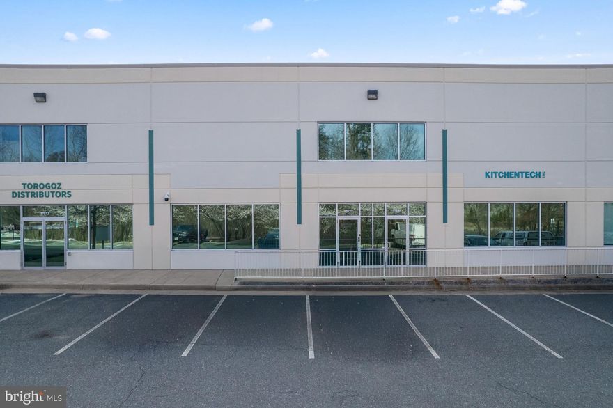 A rare opportunity to acquire a ±5,215 SF flex/warehouse condominium at Dumfries Commerce Center, a premier tilt-up concrete business park positioned along Jefferson Davis Highway (US Route 1) in Dumfries, Virginia. Unit #6 delivers 4,362 SF of warehouse space on the main level with 20-foot clear ceiling heights, a 12'×14' drive-in door, and heavy power 250-amp, 480/277V service, purpose-built for industrial, distribution, and contractor operations. A structural mezzanine adds an additional 853 sqft of usable space perfect for expansion. A dedicated office with its own split-system A/C perfect for server rooms or executive offices.  B-1 zoning under the Town of Dumfries permits a broad spectrum of commercial uses by-right including automotive, and the site carries SBA HUBZone designation, making it accessible to qualified owner-users with as little as 10% down. Positioned between Fort Belvoir and Quantico along one of Northern Virginia's most active commercial corridors, this asset offers immediate owner-user utility and strong long-term hold value in a supply-constrained industrial market. Condo fee per month for this unit is $714.25
