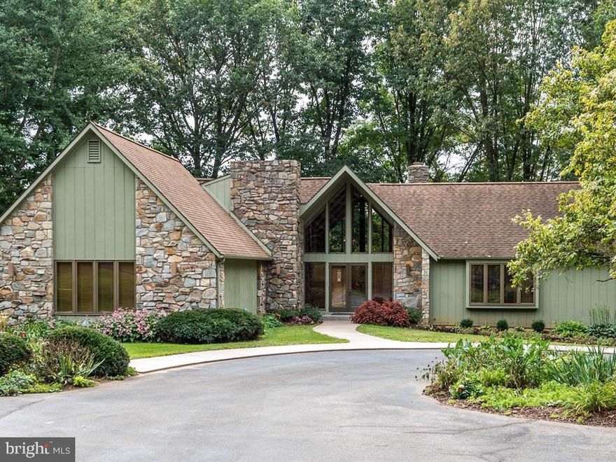 Spectacular 5-bed, 3.5-bath with pristine setting overlooking meadows and private woodlands on a 10.9 acre lot. This custom contemporary home features a large family room with floor-to-ceiling windows that offer lots of natural light and breathtaking views. First floor also includes master bedroom suite with wood-burning fireplace, and a beautiful kitchen with quartz counter tops, and Jenn-air cook top. Second floor living space is perfect for in-law quarters, with private bedroom, full bathroom, kitchenette, and living room. The large finished basement includes two additional bedrooms, a second family room with fireplace, bar with sink, and a wood burning stove. Extensive deck and patio are surrounded by mature trees, and create an ideal space for entertaining. Detached barn/stable offers plenty of storage, work shop space, 2 garage bays, and has room for horses.