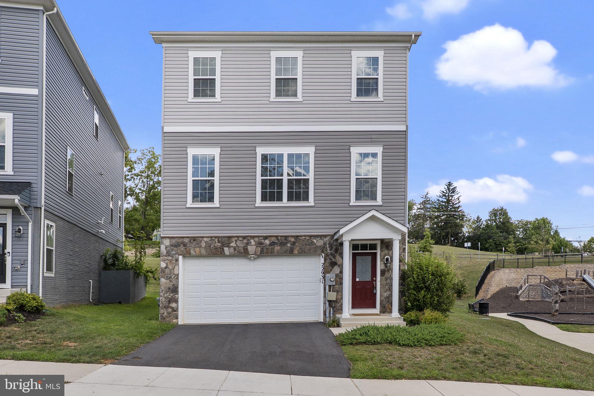 This like-new 4-bedroom, 3.5-bath residence offers over 3,600 square feet of beautifully designed living space in the heart of Clarksburg. Thoughtfully crafted with modern finishes and an open, flowing floor plan, this home is both elegant and functional.
The entry level welcomes you with a spacious family room that opens directly to the back patio, ideal for indoor-outdoor living. A private bedroom, full bath and access to the attached 2-car garage complete this versatile level.
The main level is the centerpiece of the home, showcasing a stunning gourmet kitchen designed to impress. Featuring an oversized center island with seating, a breakfast bar, gleaming granite countertops, and gas cooking, this space is perfect for both everyday living and entertaining. The kitchen is flanked by a sun-filled dining area, a private office, and a generous living room—creating a seamless balance of style and comfort.
The top level offers three additional bedrooms, two full baths, a versatile loft, and a convenient laundry room. The luxurious primary suite is a true retreat, boasting two walk-in closets and a spa-inspired ensuite bath with dual vanities and a glass-enclosed shower.
Ideally situated near premier shopping, dining, parks, the Clarksburg Premium Outlets, and I-270, this home offers the perfect combination of sophistication, space, and convenience.