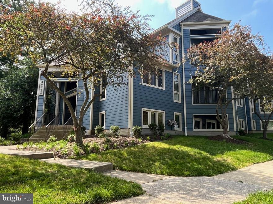 This cozy 2 bedroom 2 bathroom end-unit condo is located on the ground floor in the back of the building.  Floor to ceiling windows bring in a lot of natural light .   Spacious living room with cozy fireplace, walk out through two sliding doors to an open space and  a patio to relax.  Dining room.  Laundry is off the kitchen. Both bedrooms have walk - in closet.  Close to shopping and dining, parks  with easy access to all major routes including US-29, I-95,  I-70, MD-100, I-695.