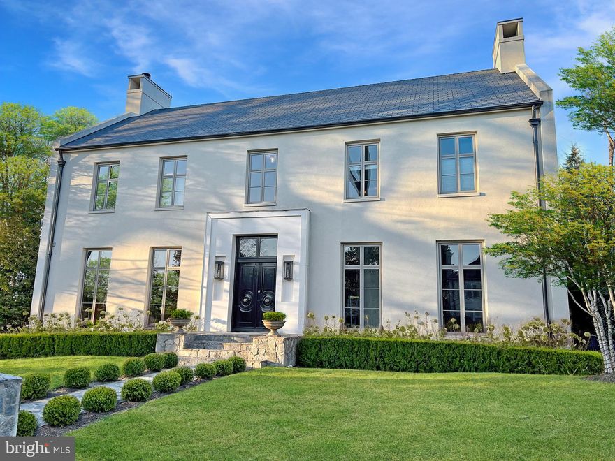 Prominently positioned on one of Kent's most desirable streets, 4929 Lowell has been meticulously crafted for the most discerning tastes. This exquisite property was constructed by renowned architect and designer, Carmel Greer as her personal residence, and offers approximately 7,500 square feet of living space designed for sophisticated living and entertaining. The stately facade sets the precedence for what awaits inside. Upon entering, the foyer introduces the residence with soaring ceiling heights and a dramatic staircase that connects the entertaining and private spaces, including a separate home office.  Through the expansive and light-filled open-concept family and dining room, floor-to-ceiling windows offer unobstructed views of the fieldstone terrace and 15x33 saltwater pool. The adjacent gourmet kitchen is an entertainer's delight with an impressive island, high-end AGA stove & True refrigerator, plus a tremendous amount of counter space plus storage in the custom cabinetry. The backyard rivals any luxury resort with the saltwater pool, cabana, and outdoor kitchen with commercial grade grill and True refrigerated drawers. On the second level, the spacious primary suite includes a private terrace, bespoke dressing room, and a stunning spa bath replete with a walk-in shower in addition to the grand soaking tub. Three additional bedrooms all with ensuite baths complete the second floor. On the third floor you will find an expansive recreation room and 5th bedroom with an ensuite bath. The lower level includes a large, mirrored gym and separate guest suite with full kitchen and living space, with direct access to the outside.  Located close to schools, parks and major commuting routes, 4929 Lowell Street NW is unquestionably one of  the finest residences to be offered in Washington, DC.