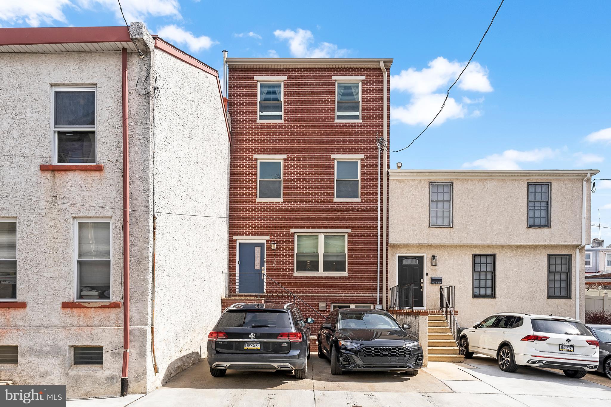 Amazing opportunity to own this newer construction home right in the heart of Manayunk with TWO-car parking! Just steps from Main Street, this home greets you with a spacious and open living area with an electric fireplace. This space flows into the dining area , perfect for entertaining, and kitchen with tons of storage and large island. There is also a half bath on this floor for convenience. Off the kitchen is the backyard with enough space to dine al-fresco, BBQ and garden. The second floor has two generously sized bedrooms and a full bathroom. The top floor welcomes you to a bonus space that could be used as an office, nursery, or sitting room. The large primary bedroom has soaring ceilings, a beautiful bathroom and great sized closet. This floor also provides access to the roofdeck (which was just re-coated) with unbeatable views of Manayunk and the city. This space provides an amazing opportunity to have guests over and enjoy the scenery!  The fully finished basement features tiled floors, egress onto the back patio and tons of space for a home gym, entertaining space or playroom! The front driveway offers off-street parking for two cars and sets the home back from the street. This home has approximately 3 years left on the tax abatement! Come see it before it's gone!