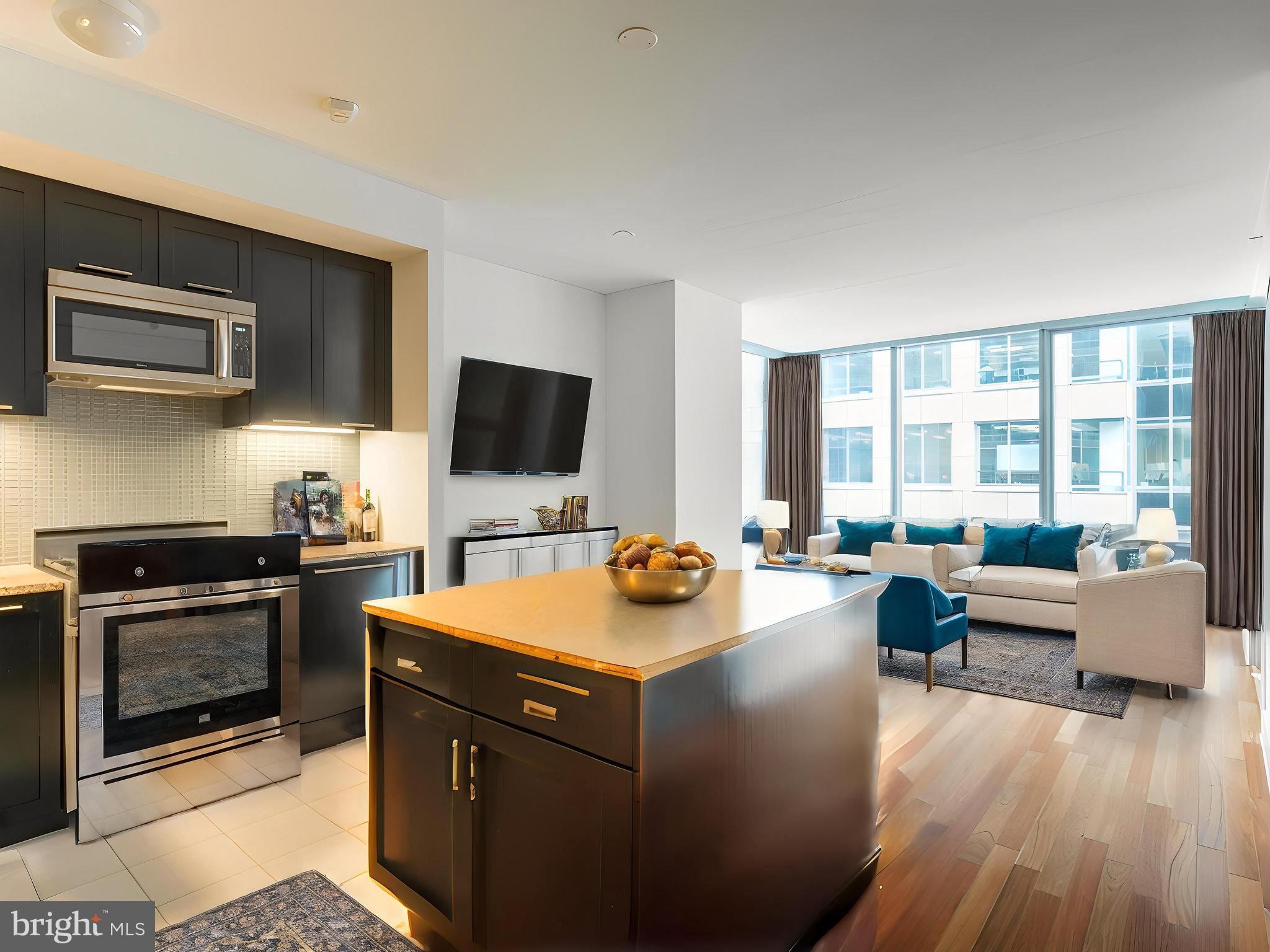 Welcome to the prestigious Ritz-Carlton Residences in the heart of Center City Philadelphia. Step into refined city living with this stunning 1-bedroom, 1.5-bath residence. Designed for elegance and comfort, this home features soaring ceilings and breathtaking floor-to-ceiling windows that flood the space with natural light and offer striking city views. The gourmet kitchen is a chef’s dream, featuring a large center island perfect for entertaining or casual dining, top-of-the-line appliances including a Sub-Zero refrigerator and Viking gas range, and sleek cabinetry that blends style with function. The spacious primary suite includes a spa-inspired en suite bathroom adorned with rich marble finishes, a deep soaking tub, dual sink vanity, and a glass-enclosed shower—your private retreat after a day in the city. A full-size in-unit washer and dryer add to the ease of everyday luxury. Enjoy world-class Ritz-Carlton service, including a 24-hour concierge and doorman, valet parking, and access to the Residents’ Mercedes EQS house car. Residents indulge in exclusive amenities; a state-of-the-art fitness center, yoga/pilates studio, indoor lap pool, hot tub, a stylish residents lounge, private media room, and expansive outdoor terrace with a large dog run. The private residents’ park, complete with a tranquil waterfall, offers a peaceful oasis in the city. Live in luxury, surrounded by unmatched service and sophisticated amenities—this is elevated urban living at its finest. Some photos have been virtually staged.