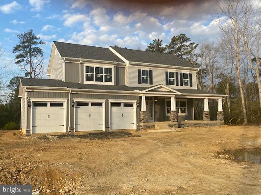 ONE ACRE Plus Wooded Level LOT *** THE DEVONSHIRE II Model, Elevation III  w/a "3RD" CAR GARAGE ****FABULOUS KITCHEN w/Super Island & GRANITE Counters *** Huge Pantry *** STAINLESS appliances  *** EXTENDED FAMILY ROOM complete w/fireplace  ***  full BASEMENT w/FULL BATH /REC ROOM and DEN ***Includes a Board on Board rear fence with 1 single gate and 1 double  gate  ***