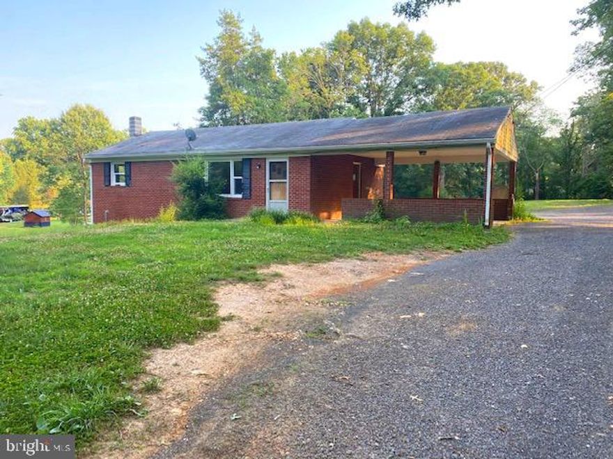 Looking for a rehab project with resale potential? here it is....in a great location -  just minutes from Town of Culpeper off of Rt. 522 north with a lovely setting on 1.75 acres.  Comcast is located on Woodland Church Rd so the internet is available. The all brick home has potential and some good things about it including double hung replacement vinyl windows already done and carport.  It's a two bedroom and one bath set up with the potential to add another Bedroom.  It's ready for you to put your touch on it. Sold strictly "as is".