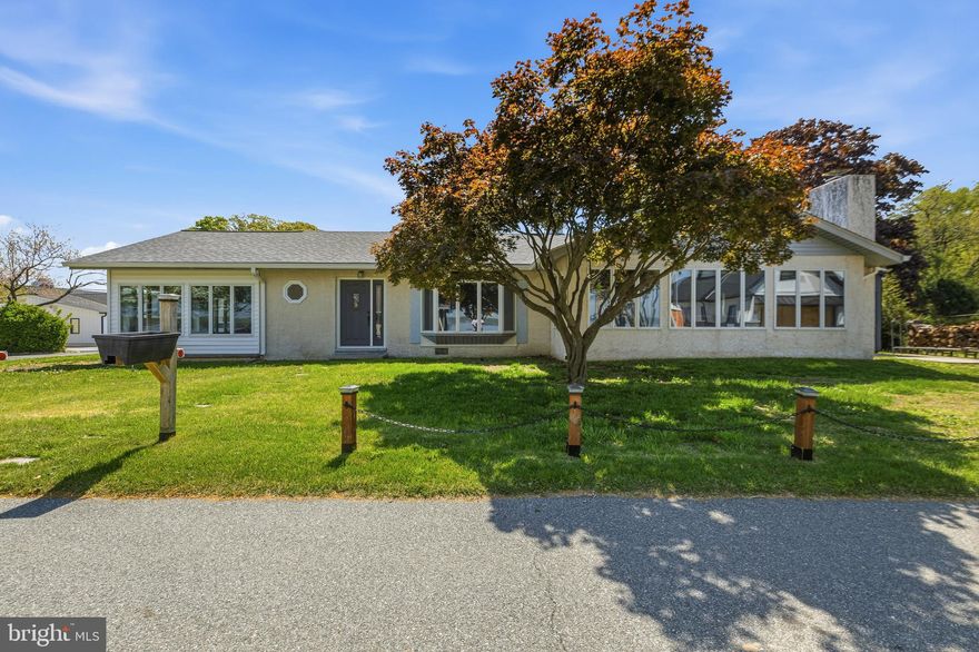 *Professional Photos will be added soon.*
Set in the water-front community of Long Point, this single-level 3-bedroom, 2-bath ranch offers nearly 1,900 square feet of space, character, and potential, paired with a lifestyle that most people only get on weekends. From the moment you step inside, the home feels open, airy, and filled with natural light. Cathedral ceilings and exposed wood beams carry through multiple spaces, giving the home a warm, elevated feel. To one side, the living room features hardwood floors, a large bay window, and easy flow into the kitchen and dining area, where a wood-burning fireplace adds just the right amount of charm. The kitchen is centered around a generous island with plenty of space to gather, with room to update and make it your own. On the opposite side of the home, the primary suite offers privacy with its own ensuite bath and soaring ceilings. Just beyond, a standout feature of the home reveals itself - a massive sunroom wrapped in windows with exposed beams and cathedral ceilings. It’s the kind of space that can become anything: a second living room, entertaining area, creative studio, or your favorite place to unwind. This space also connects directly to the garage and driveway for added convenience. Two additional bedrooms, a full hall bath, and a dedicated laundry/utility room round out the interior, with the entire home finished in bright, neutral tones and updated lighting throughout. While some areas offer the opportunity for cosmetic updates, the big-ticket items are already taken care of. HVAC and water heater just one year old, and a roof approximately five years old. Step outside and you’ll find a nicely sized backyard that offers even more room to enjoy and expand your outdoor living space, whether that’s entertaining, relaxing, or creating your own backyard setup. A brand-new shed is included with the property, providing convenient storage for tools, water gear, or seasonal items. And then there’s the lifestyle. Water views stretch across the front of the property, with a boat ramp just steps away - giving you immediate access to the Bohemia River, which connects to the Elk River and beyond. Whether you’re launching your boat for the day, renting a slip for the season, or simply enjoying the view from nearby picnic areas and playgrounds, the water becomes part of your everyday routine. A private neighborhood beach just down the street adds even more to the experience. Minutes from local favorites like Bohemia Manor and Broken Spoke Winery, and a short ride to Chesapeake City, this is a location that blends relaxation, recreation, and convenience in a way that’s hard to replicate. A home with great bones, strong systems, outdoor space, and the kind of setting that turns everyday living into something more.