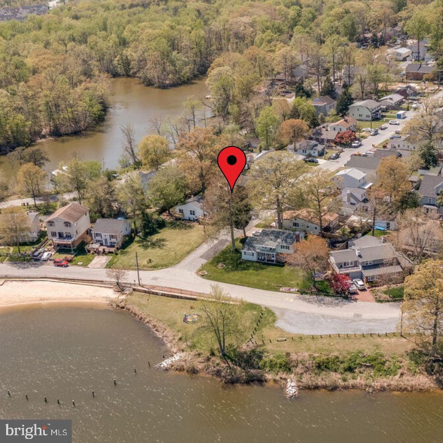 Close to an array of natural attractions, live like you're on vacation every day and equidistant between Baltimore and DC., major interstates and highways, including, Rt-2, I-97, and Rt-50, are easily accessible from this home. You'll find abundant summer activities just a short walk from the front porch. Grab your swimsuit, and make your coastal lifestyle a reality. 

This lovely 4-bedroom, 3-bath split-level ranch is remarkable in the prime Woodland Beach area. The home is just steps from one of the community's sandy beaches, boasting a floating-swim platform. The shopping and dining options of Village at Lee Airpark are within comfortable driving distance. In addition, the location is within pedestrian range of nearby schools. You'll enjoy relaxing views of Glebe Bay.
 
With fencing in the rear, the large yard offers privacy and room for enjoyment. Representing the welcoming personality of the home, a front-facing, breezy porch is a nice spot for relaxing with beverages, perhaps while hosting friends. The centerpiece of the fully fenced backyard is a refreshing swimming pool.
 
As you step inside from the welcome mat, touches of lifestyle value will welcome you home. Sunbeams deliver warm natural light. The crackling warmth of 2 wood-burning fireplaces can be found in the living room and basement. The kitchen, which is roomy enough to accommodate conversation with visitors during food prep, features marvelous counter space and major appliances in an attractive layout. Amid the natural illumination, this focal point of culinary endeavor is a movie set awaiting its writer/director/star (you!). For sanctuary from the day, the primary bedroom is where to be. The other 3 bedrooms, with plenty of closet space, offer the luxury of private space.
 
The driveway easily parks two vehicles.
 
The finished basement, conveniently outfitted with a full bathroom, is currently in use as a rec room and is easily reconfigurable to suit your vision.

Escape with us to the community of sandy beaches, marinas, clubhouse, and swimming zones. You'll love this well-established community and easy commute to Annapolis, DC, and Baltimore. Call now for your very own private tour.
 
It's a great idea to make a competitive offer on this one.