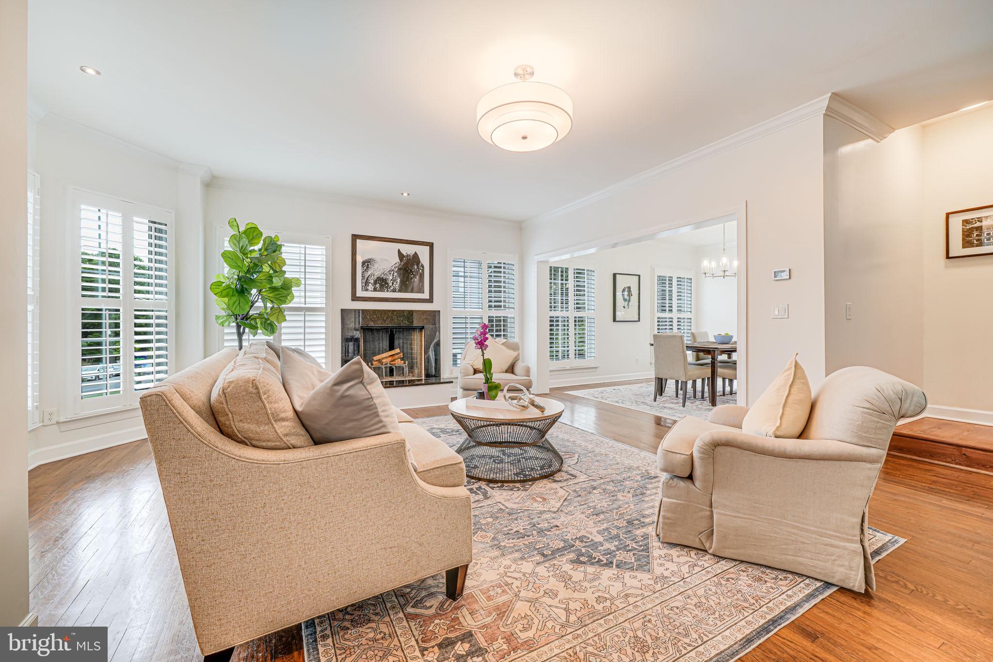 Welcome to The Mason Modern, a beautifully updated and sun-soaked residence offering over 3,700 square feet of stylish living in one of Arlington’s most desirable locations. Perfectly situated directly across from Virginia Hospital Center, this home makes commuting a breeze for healthcare professionals or anyone who values quick access to major employers, top-notch medical care, and the conveniences of North Arlington living.
Built in 2002 and thoughtfully updated through 2025, this four-level home blends space, function, and comfort. The main level invites you in with hardwood floors, a bright sitting room, and natural light streaming through oversized windows. The open living and dining area with recessed lighting and a cozy fireplace are perfect for entertaining, while the updated kitchen (2024) offers a wall oven, cooktop, and fresh finishes for the modern chef. Also on this level is a spacious bedroom with a private full bath, ideal for guests or main-level living flexibility.
Upstairs, hardwood floors continue throughout two bedrooms connected by an updated Jack-and-Jill bath, plus a versatile den or office nook for remote work. The standout primary suite feels like a true retreat, featuring a large walk-in closet and spa-like en-suite bathroom with a newly added walk-in shower (2024).
The finished third level provides endless possibilities for a playroom, home theater, or creative space. Downstairs, a fully finished basement offers a bonus room with its own full bath and a kitchenette setup perfect for guests or multi-generational living.
Outdoor living shines with a sunny rear deck, fully fenced backyard, and updated stone and gravel walkways, complemented by a 2020 French drain system for low-maintenance upkeep. Additional updates include plantation shutters (2020), refinished staircases, fresh interior paint (2025), and front porch enhancements (2024). A two-car garage adds convenience and storage.
Just minutes to Clarendon, Ballston, Metro access, and commuter routes, this home delivers unmatched accessibility to shopping, dining, and entertainment while offering the serenity of a residential neighborhood. The Mason Modern combines location, light, and livable space in one exceptional package.