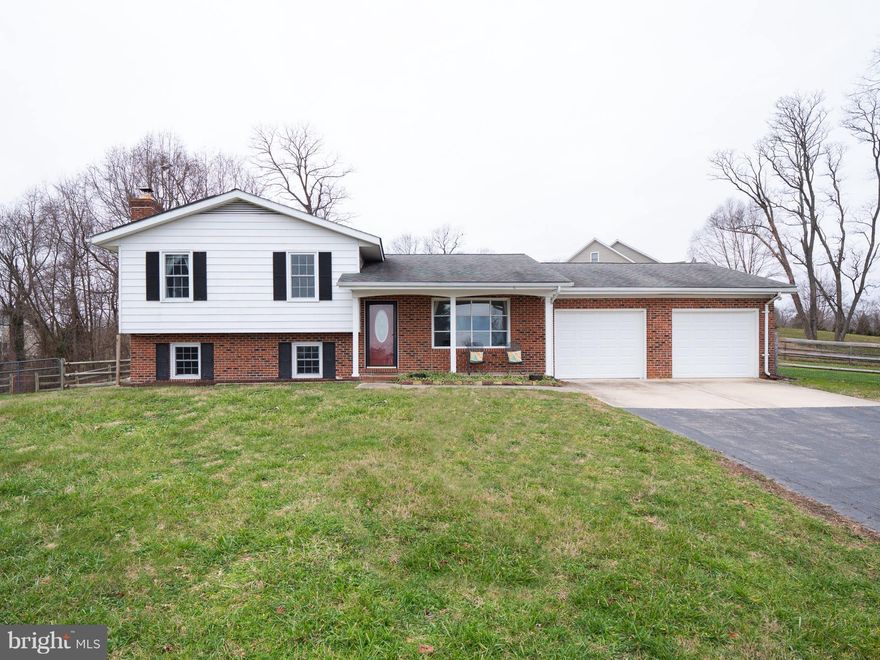 This renovated split level home is perched on 2 acres of hilltop land in Tracy's Landing overlooking the town of Deale and the Chesapeake Bay. Renovated kitchen/bathrooms, freshly painted throughout and Master bedroom w/ensuite makes this home move-in ready. Lower level family room with brick fireplace and sliding barn doors for that farmhouse charm. Large rear screened porch off kitchen for easy entertaining and for watching your kids play in your fenced backyard. Start the year off right with this wonderful home and start enjoying your winter water views today. Welcome Home!