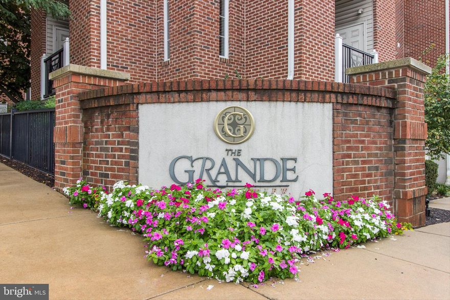 Welcome to this highly sought-after 2-bedroom, 2-bath unit at The Grande at Riverview in Conshohocken, complete with 2-car ​deeded garage parking! This beautiful home features wood floors throughout the kitchen, living, and dining areas. The spacious kitchen boasts granite countertops, stainless steel appliances, gas cooking, a breakfast bar that ​can seat four with pendant lighting, crown molding, and maple cabinets. Additional features include undercounter lighting, a deep stainless steel sink, and some pull-out drawers in the cabinets for added convenience. The living and dining areas offer crown molding, recessed lighting, and a slider leading to a private deck area, plus a utility cl​oset. The primary bedroom provides a serene retreat with crown molding, a sitting area, a walk-in closet, a linen closet, and a luxurious primary bathroom with ceramic tile, double sinks, a soaking tub, and a separate shower stall. The second bedroom also has a walk-in closet, crown molding, and large windows. The hall bath is spacious with ceramic tile flooring and a tub/shower combo. ​The convenient full size Laundry area has shelving for added storage. Enjoy resort style amenities with a well-equipped fitness center, outdoor pool, landscaped courtyards - some with grill areas.  This home is ideally located just steps from the ​commuter rail line to Philadelphia, walking​/biking ​trails along the Schuylkill River, restaurants, ​Conshohocken Brewing Company and major highways. With easy access to Philadelphia International Airport, local colleges, the PA Turnpike, and more, this home offers the perfect blend of convenience, comfort​ and easy living.