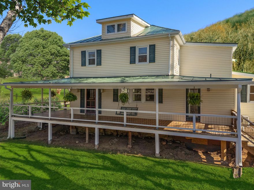 THIS is the one you've been waiting for.  Welcome to "Hollow Bound", nestled in the heart of the Blue Ridge Mountains, this one-of-a-kind 4-bedroom, 2-bathroom home sits on a picturesque 7-acre property that was once a beloved campground. Originally serving as the camp headquarters, this 2,100 sq. ft. residence is steeped in history and surrounded by breathtaking natural beauty.

Step onto the wraparound porch and take in the peaceful views of the babbling brook, serene pond, and towering hardwoods. The land features stunning stacked stone walls and a rustic red barn with a stacked stone foundation, adding to the property’s timeless charm. A rear storage shed offers extra space for tools and equipment.

Inside, the home boasts beautiful hardwood floors throughout, enhancing its warm and inviting atmosphere. Spacious living areas provide the perfect space to relax after a day of exploring nearby hiking trails or enjoying the tranquil setting. Whether you’re looking for a private mountain retreat, a homestead, or a unique piece of Virginia history, this property is a rare gem that blends past and present in a truly special way.

Don’t miss your chance to own this idyllic slice of the Shenandoah Mountains