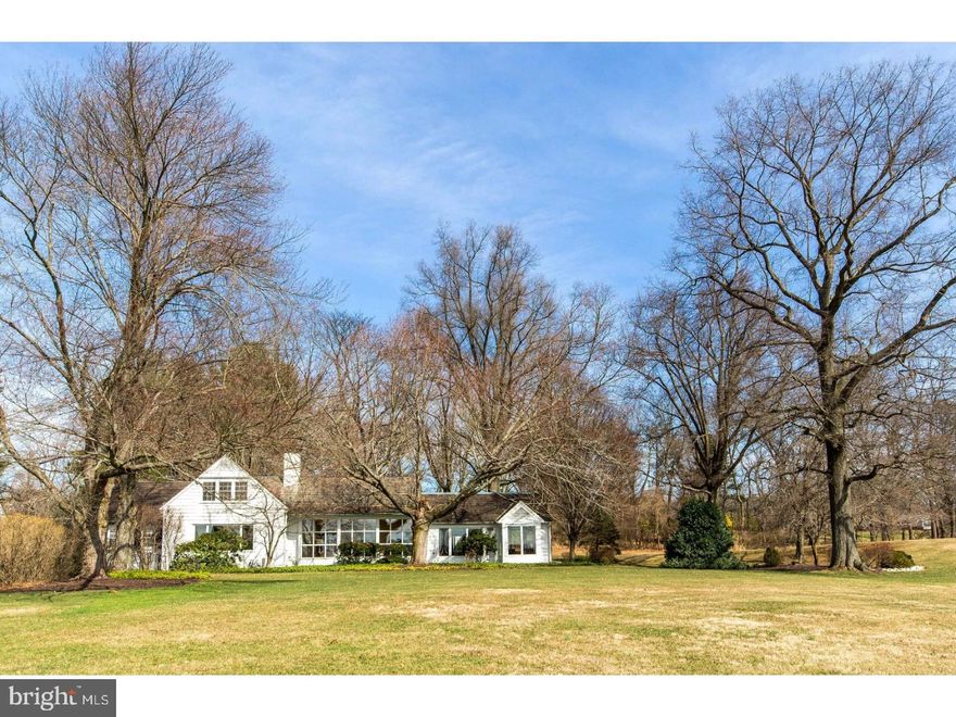 On a private road in a world-class neighborhood, surrounded by mature trees and manicured lawns, this gracious home has panoramic views over 22 acres of meticulously tended grounds, within walking distance to the Weyhill Golf Course of the Saucon Valley Country Club. This exceptional home is tucked away in the most enviable and private position on the road.  Walls of windows in every room frame the pastoral and protected vistas. Part of a lovely eight home enclave that is reminiscent of a New England village green, the design is so clever that, from all but one window, no other home can be seen.   There is a wonderful flow for entertaining in the large living room with rounded window wall and formal fireplace, into the family room addition with a second fireplace and lovely, built-in bookcases.  All is enveloped by a terrace with fountain and long distance views and perfect privacy.   An expansive kitchen offers space for creative chefs and opens to a breakfast room, the dining room and patio beyond.  A first floor master suite has generous proportions and is adjacent to a guest suite and second bath.  On the second floor, there is bedroom, bath and plenty of room for expansion into the two side attics. Hardwood floors enhance every room, on every floor.  Here, worry-free luxurious living has been elevated to a higher degree in a location that rarely becomes available. Weyhill Circle invites one to linger and enjoy the beauty of the environment and the exquisite privacy of a privileged position amidst a 22 acre piece of paradise.