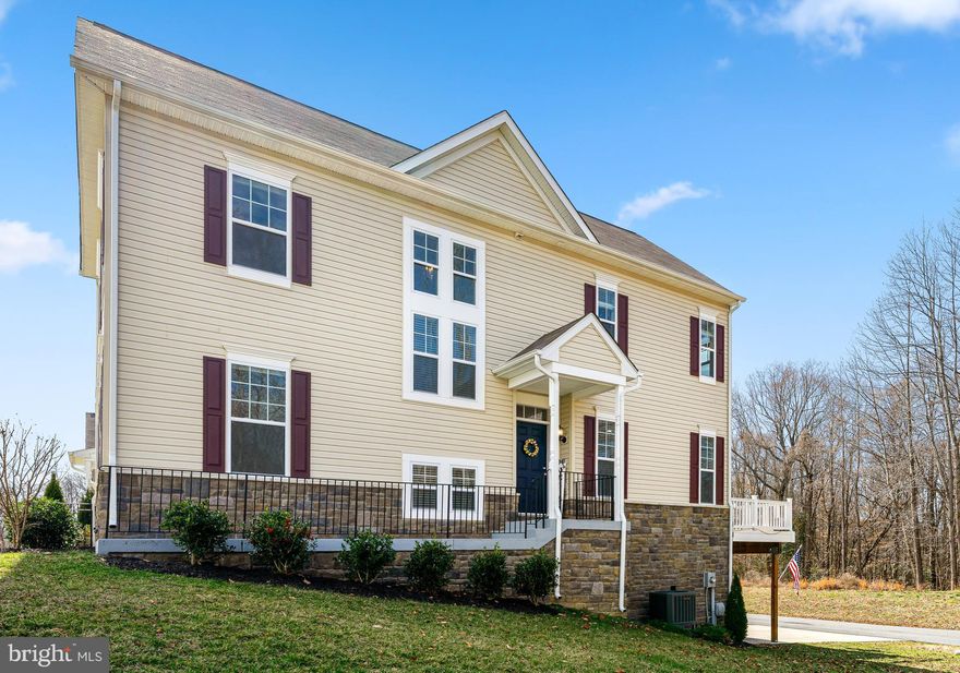 Stunning Townhome in Clarks Rest. 
Welcome to this beautifully maintained, nearly-new end-unit townhome in the sought-after Clarks Rest Community in the heart of Leonardtown.  Nestled among lush trees, this home offers unparalleled privacy with serene wooded views from both the rear and side.
Step inside to a spacious main level featuring luxury vinyl plank flooring and a convenient bonus bedroom perfect for guests or a home office. The separate dining room boasts an upgraded crown molding package, adding a touch of sophistication. The chef-inspired kitchen is a dream, showcasing sealed quartz countertops, a designer tile backsplash, 42" maple cabinetry with modern pulls, under-cabinet and over-cabinet lighting, and a separate coffee bar station. You'll also enjoy the convenience of a pantry and appliance closet, as well as a breakfast bar, table space, disposer, built-in microwave, and recessed lighting. The stainless steel appliances complete the sleek, contemporary design. A sliding glass door opens to your rear deck, offering a peaceful escape with beautiful nature views.
The spacious family room, just off the kitchen, features a newly built-in electric fireplace with wood mantle, a ceiling fan, and windows providing natural light and serene views, making it the perfect spot for relaxation and gatherings.
Upstairs, you'll find three generously-sized bedrooms, two full bathrooms, and the laundry for added convenience.  The owner's suite is a true retreat with a generous walk-in closet and a luxurious spa-like bath featuring a large dual sink vanity, a separate soaking tub, and a frameless walk-in shower with beautiful ceramic tile. 
The lower level offers even more space, with a recreation room, an additional guest bedroom, a full bath, and a walkout to your two-car garage.  A bonus feature of this home is the extra large storage closets on all three levels!
This home is just three years old and comes with the peace of mind of a Builder's 2-10 Warranty that's valid for an additional seven years.  VA Assumable Loan at 3.875% (Veteran Only with Eligibility Certificate). The home has been freshly painted throughout, and the deck was sealed within the past 6 months, ensuring this home is ready for you to move in and enjoy. This property was constructed with the capacity to support a future elevator which distinguishes the property value from typical Leonardtown townhome inventory.
Clarks Rest residents enjoy a range of community amenities, including the community pool, a baby/toddler pool, sports courts (basketball and tennis), a beautiful clubhouse, walking nature trails, playgrounds, and open green spaces for relaxation and play.  
Experience the best of Leonardtown living with the seasonal Leonardtown Trolley.  Hop on right from your neighborhood sidewalk and enjoy the ride around town with stops at the local winery, restaurants, pubs, coffee shops, charming bakeries, and of course, the Leonardtown Wharf.  Spend your free time at nearby parks, beaches, museums, boardwalks, and theaters. 
Located just a short drive from Patuxent Naval Air Station (PAX), this home also offers access to excellent Leonardtown schools: Leonardtown High, Leonardtown Middle, and Leonardtown Elementary.
Clarks Rest is a "walkable" community providing sidewalks throughout that also lead to the charming downtown with many stops along the way, including the library, schools, parks, and more. Love where you live here in Leonardtown, a most convenient place!