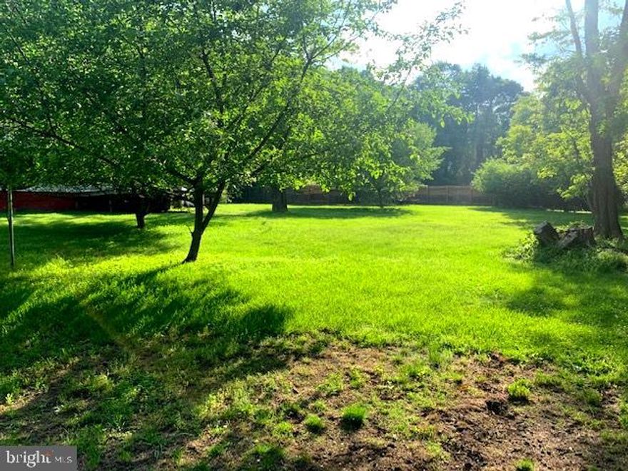 Enjoy the private setting not far from Main St.  Water is public and sewer is septic tank. This land has lots of possibilities. Selling AS IS. Storage sheds on property. The mobile home is a result of a fire and would need removed. Do not enter mobile home.