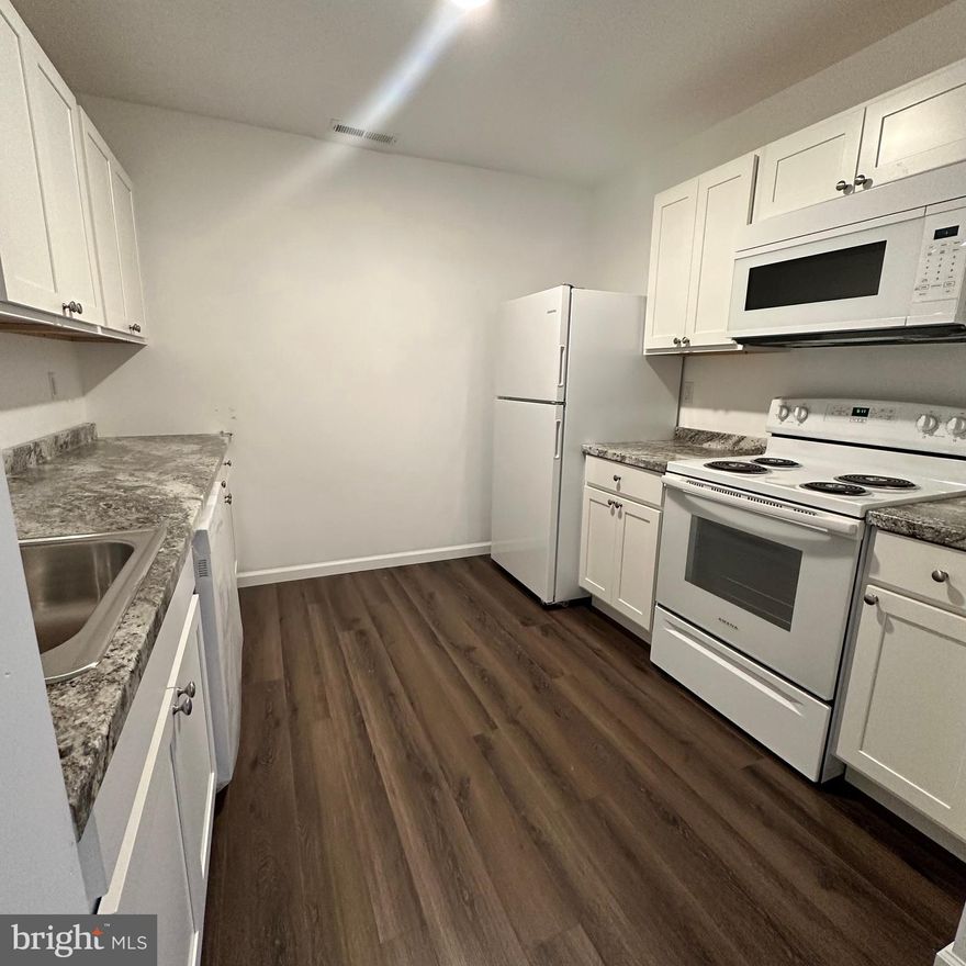 Welcome to this all-new and harmoniously designed three-bedroom apartment in the quiet town of Hurlock, MD. Centrally located and just a three-minute journey from Hurlock Elementary School, this property blends convenience with the much-desired tranquillity of local living.

The key features of this just finished - NEW - 3-bedroom, 2-full bathroom haven include a spacious open floor plan, luxury vinyl plank flooring, owner's suite with walk-in closet and soothing color scheme throughout, giving a sense of airy openness. Large windows grace the apartment, ushering in an abundance of natural light, and accentuated with subtly elegant recessed lighting. Residents will have the added comfort of a dedicated parking.

Outfitted with central heating and cooling, the apartment promises year-round comfort. But the convenience doesn't stop there; this rental includes trash service and yard maintenance. The unit's amenities elevate the living experience, boasting an in-unit washer and dryer, providing ease for everyday chores.

Unwind in a place brilliantly combining comfort and convenience in every corner. Step into your new lifestyle in Hurlock, MD. Don't miss this opportunity, come and see your new home!

No Pets.