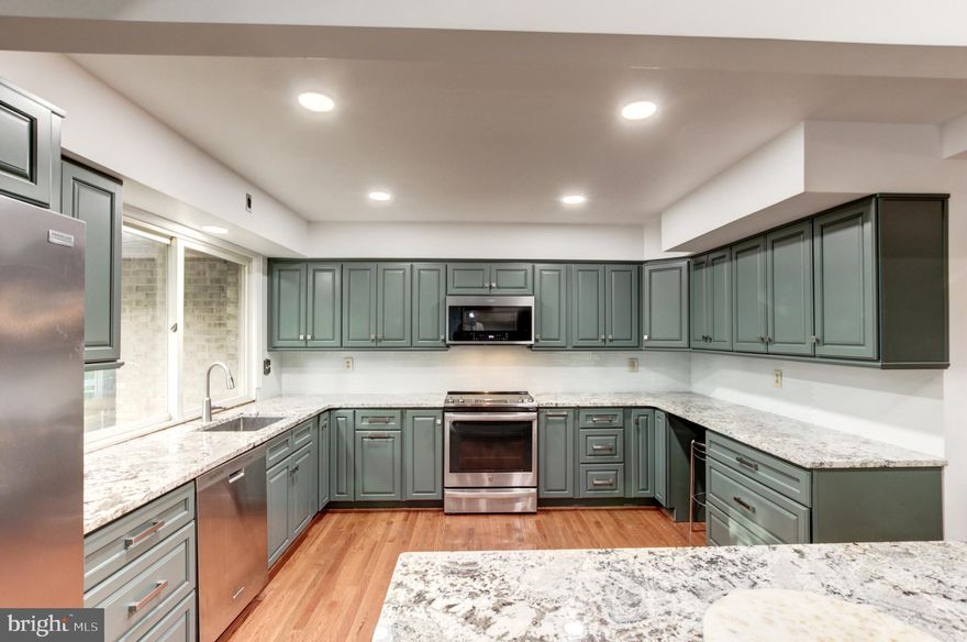 Welcome to the sought after Manor Park! Gorgeous home in a beautiful desirable location! Drive up to the home and be greeted by a private entrance into the front patio. Gorgeous newly painted doors welcome you as you step inside the foyer.  With all the living space on one floor, this home is sure to be a great choice! Look into the family room with vaulted ceilings and exposed beams with bright windows.  Wooden floors grace the home throughout! To the right are the 3 spacious bedrooms. Both hallway full bath and master bath have been remodeled. The master bedroom and spare bedroom have new closet systems as well! Enjoy cooking in the completely renovated kitchen with all new appliances, granite countertops, recessed lighting, and backsplash! Enjoy the fireplace in the family room or look out onto the new deck in the backyard. In the hallway to the spacious 2-car garage, there is a half-bath and laundry room, with Samsung washer & dryer. There is an entry into the unfinished basement as well by the garage. The home has been newly painted inside throughout as well. Step outside of your home and you're minutes away from a walk to Manor Country Club to enjoy golf or entertainment activities. (Manor Country Club membership NOT included). You are also within minutes drive to shopping, restaurants, and metro station. (More photos coming soon!)