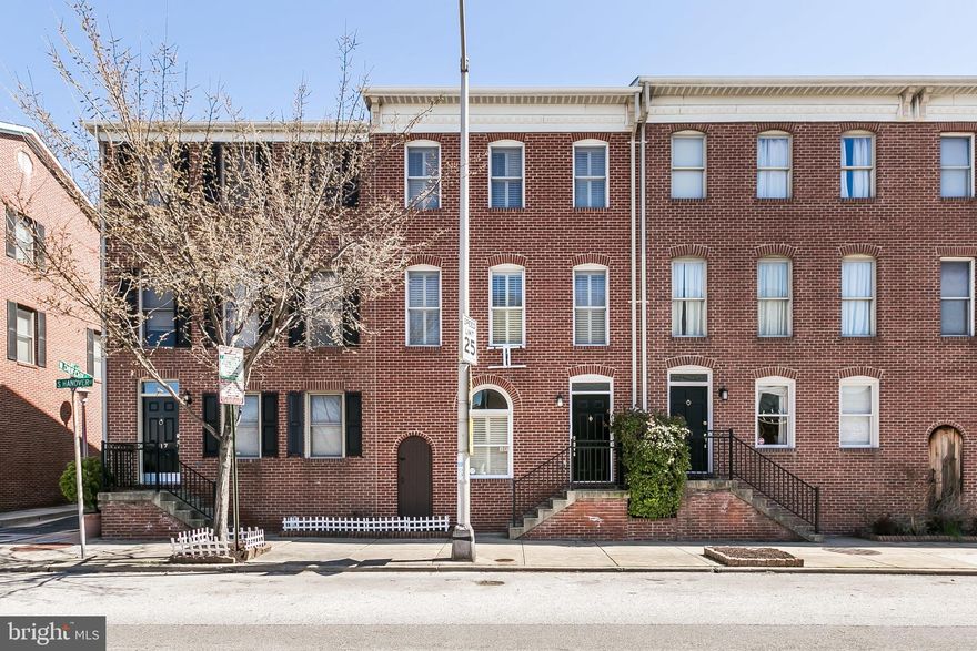 City living awaits you at 819 S. Hanover Street! This 3 bedroom, 2.5 bath townhome with attached 2-car garage is perfectly located in Federal Hill, steps away from restaurants, bars, shopping, the inner harbor, Camden Yards and M&T Bank Stadium! Enter into the main level that offers a large bedroom and access to the attached garage. The second level hosts the open dining room and kitchen, with stainless steel appliances, breakfast bar and sliding glass doors that lead to the rear deck, ideal for your grill and entertaining guests, half bath, pantry and washer and dryer. Continue through to the spacious living room with fireplace and large windows bringing in tons of sunlight. The third level hosts 2 bedrooms both with vaulted ceilings, walk-in closets and attached full baths! Don't miss out on this beautiful home!