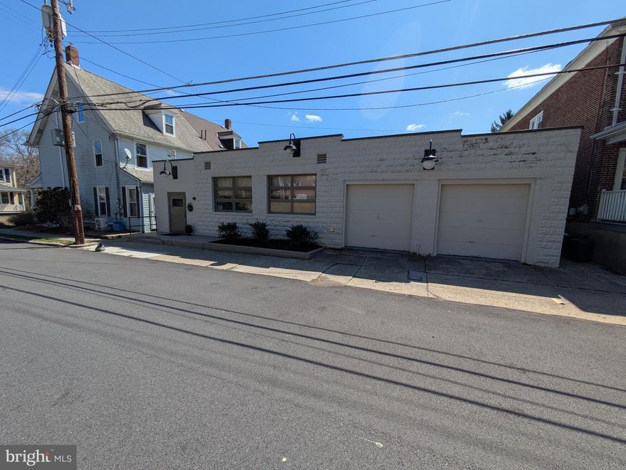 A rare opportunity in College Hill. A solid block business building in a residential neighborhood. Currently used as a warehouse and office space. It offers warmth and charm in it's flexible space. Enter the building through one of the original dairy cooler doors. There are several offices and open conference spaces that can be easily be used for storage, presentation, showroom etc. One garage bay offers easy access (the 2nd bay is finished for office or storage space). Updated gas heat and central a/c. Roof was coated in 2024. Close to Lafayette College, Easton and Route 22 and other major routes.