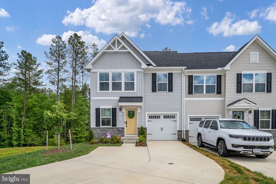 Welcome to a rare opportunity to own an almost brand new end-unit townhome that truly lives like a single-family home.  With 4 bedrooms and 3.5 bathrooms, this thoughtfully designed property offers both space and privacy in a highly desirable setting. This newly built townhome offers the convenience  of new construction with upgrades like custom blinds and a water treatment system.

The main level features convenient one-level living, including a spacious primary suite, and is highlighted by a beautiful covered porch that overlooks peaceful wooded views—with no neighbors on one side creating a sense of seclusion that’s hard to find. Whether you’re enjoying your morning coffee or unwinding in the evening, this outdoor space is a true retreat.

Upstairs, you’ll find two spacious bedrooms, hallway bathroom, along with both finished and unfinished storage spaces—perfect for organization and future flexibility.

The fully finished basement expands your living space with a large rec room, an additional bedroom, and a full bathroom—ideal for guests or multi-generational living. Step outside to the covered patio and continue to enjoy the serene natural backdrop.

What truly sets this home apart is its rare lot, featuring the only extended driveway in this townhome section.

Residents enjoy access to exceptional community amenities, including a pool, golf course, pickleball courts, walking trails, tot lot, dog park, and more—creating a lifestyle that blends relaxation, recreation, and connection.

This is more than a home—it’s a unique opportunity to experience comfort, privacy, and community all in one.