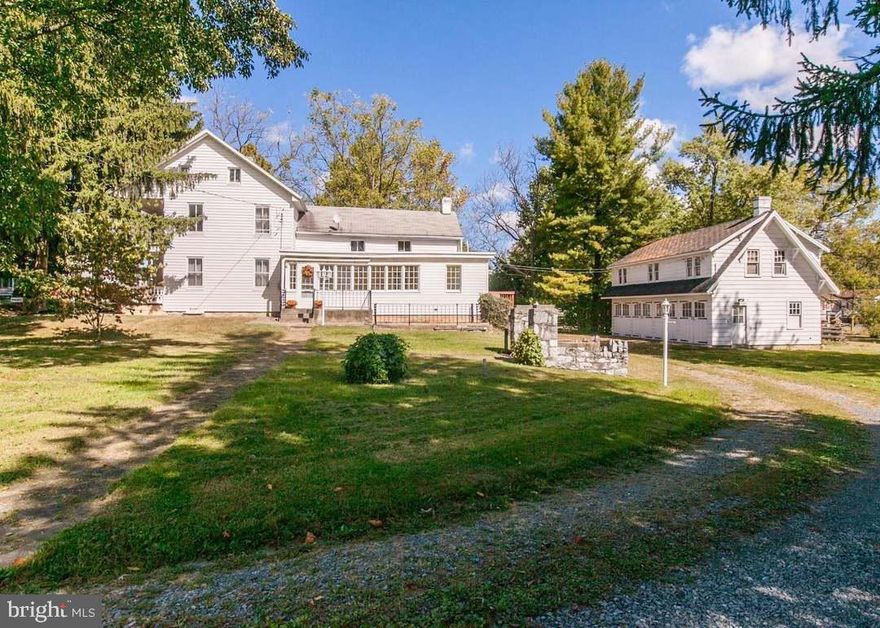 Absolutely CHARMING! This 1886 colonial has been lovingly maintained and renovated. Main level living room, enlarged kitchen leading to gorgeous sun porch, bedroom, and 1.5 baths. Upstairs has 1 full bath and 4 more bedrooms (one walk-thru which opens onto beautiful, shaded balcony with a porch swing). Walk-up attic with hardwood floors is HUGE and could be finished for additional living space. 1 ACRE lot with circular drive and 4 CAR GARAGE with walk-up loft = endless potential! 3 heat pumps, new roofs, new kitchen floor, fresh paint, and newer appliances. Convenient location, perfect for commuters: I-81 & I-70 interchange, Hagerstown Regional Airport, UNI & Meritus Urgent Care, Walmart, Martins, Sheetz, McDonald's, CVS, Walgreens, firehouse, schools, and post office all within 3 miles. MUST SEE!