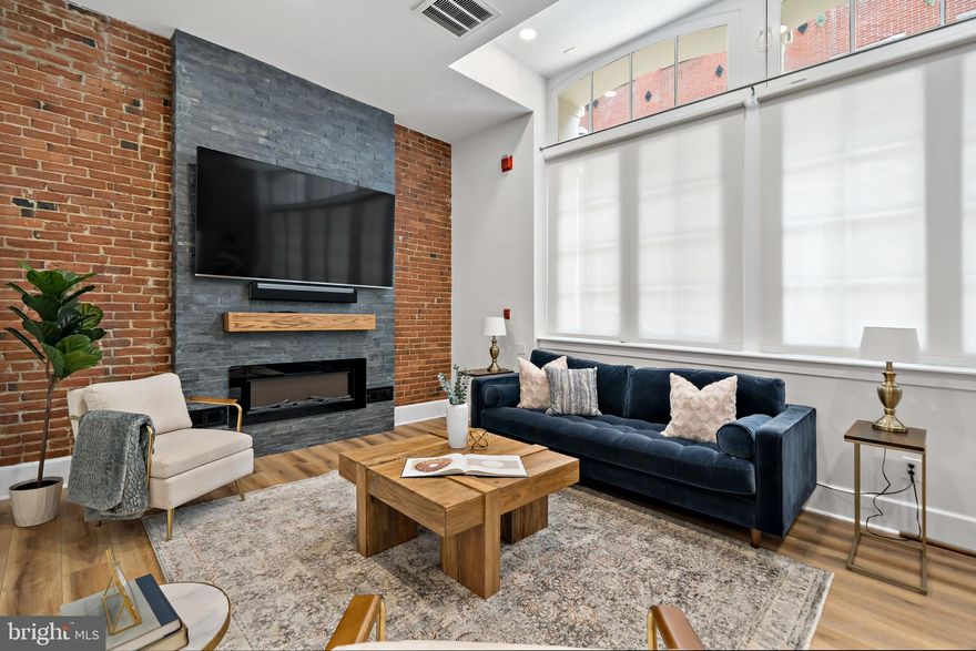 Move in Requirements:  First, Last and Security (3 months up front); $250 non refundable pet deposit (upon approval from owner)  Storage unit available for $100/per year.  Tenant must acquire Renter's Insurance.   Link to application:     https://apply.link/stDl5sc

Step into a piece of history at 102-22 Church Street, Unit 108, a stunning residential condominium exquisitely nestled in the heart of Philadelphia's Old City. This elegant unit boasts 2 bedrooms, 2 bathrooms, and a generous 1200 square feet of living space, offering a unique blend of historic charm and modern amenities.
As you enter this meticulously restored residence, you are greeted by a vast open space adorned with 11 and 12 ft ceilings, showcasing the original wood floors that grace the entrance, currently serving as an elegant formal dining room. The quintessential galley kitchen is wrapped with handsome wood cabinetry, a newer induction cook stove/oven, and high-end stainless-steel appliances, creating a perfect culinary haven.
The living area, featuring a striking brick archway and a wall of oversized windows adorned with remote control shades, allows for a diaphanous flow of natural light. The original brick walls have been exposed and finished, and a stunning black stone feature column housing the entertainment system and new electric fireplace creates a gorgeous focal point. An office/den area is nestled in a sizable alcove across from the entry to the first-floor queen sized bedroom, adorned with exposed brick and ample storage space.
Descend to discover the real gem of this residence - a completely remodeled primary suite including a wall of built-in California closets and an electric fireplace.  A magnificent bathroom is outfitted entirely with Carrera marble and a rainfall shower sits behind a glass enclosure.    The full sized, Samsung washer/dryer set is conveniently nestled in a custom closet.
The unit is outfitted with ‘smart’ tech for voice activated lighting and a nest video ring system.  The entire HVAC system was replaced in 2020.  This is also a CMX3 zoning and this unit can be used for commercial/business use as well.  
The building also offers a brand new common area roof deck, providing a perfect space for residents to commune, enjoy the waterfront views, and partake in the vibrant activities of the city.
Old City, a vibrant neighborhood, is home to cultural and historic institutions, celebrity chef restaurants, cafes, boutiques, art galleries, and design showrooms. It is also a hub for public transportation, providing easy access in and out of the city, with a Walk Score of 100+.
If you are looking for a slice of Philadelphia history combined with an urban lifestyle, 102-22 Church Street, Unit 102, is your new home. Don't miss the opportunity to reside in this exquisite piece of Philadelphia's rich history and culture.